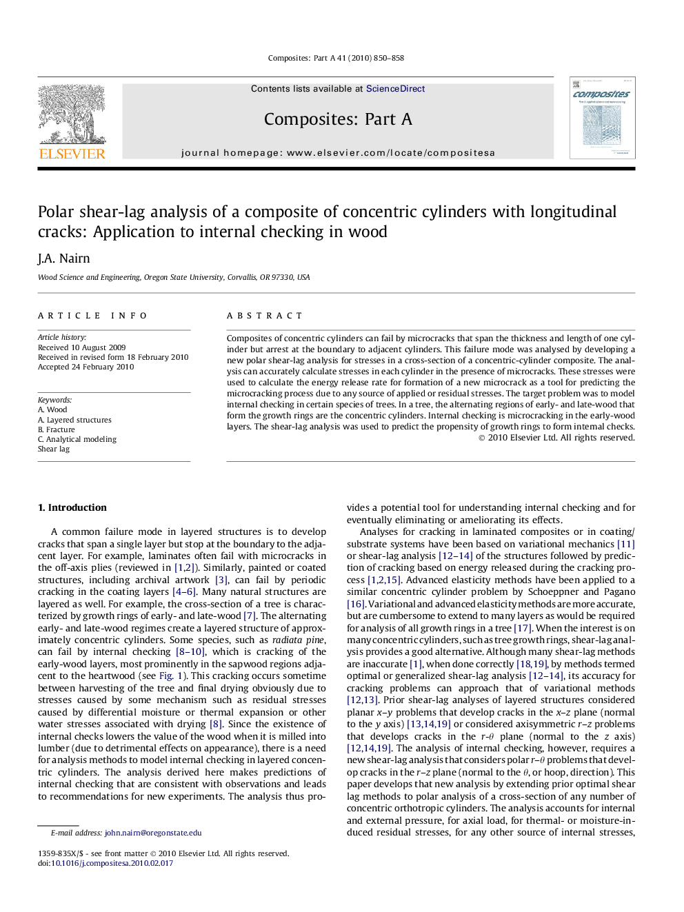 Polar shear-lag analysis of a composite of concentric cylinders with longitudinal cracks: Application to internal checking in wood