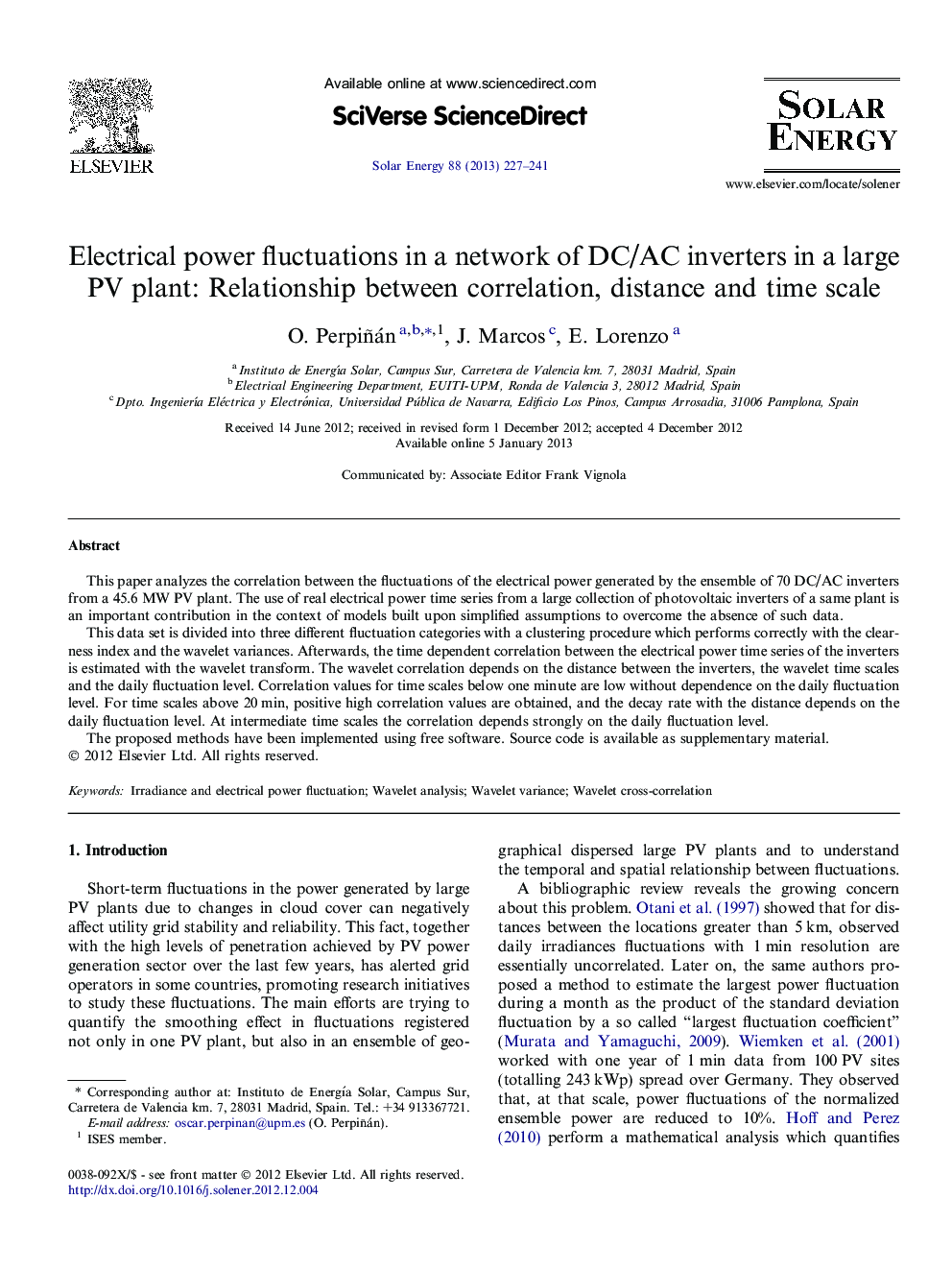 Electrical power fluctuations in a network of DC/AC inverters in a large PV plant: Relationship between correlation, distance and time scale