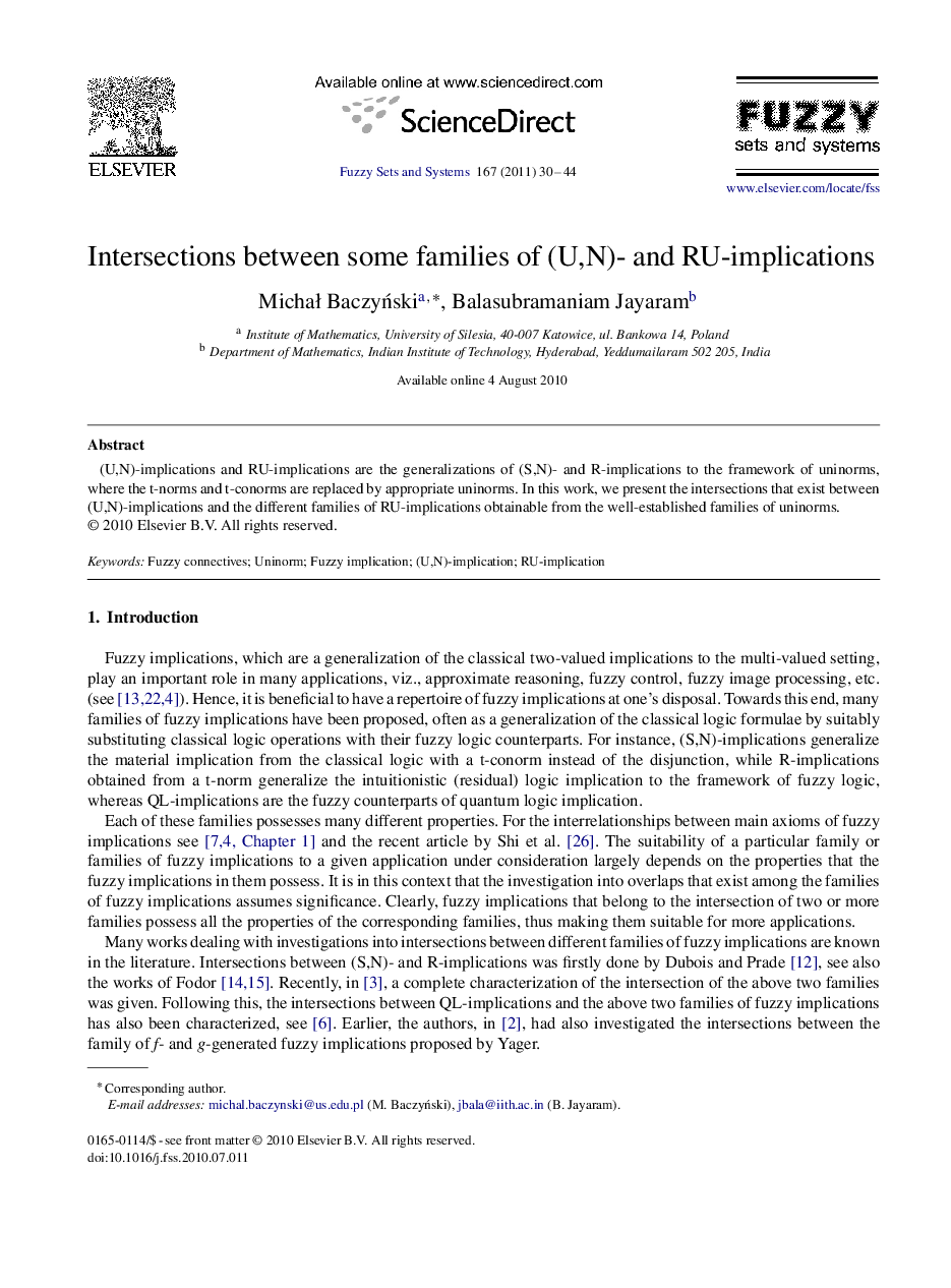 Intersections between some families of (U,N)- and RU-implications