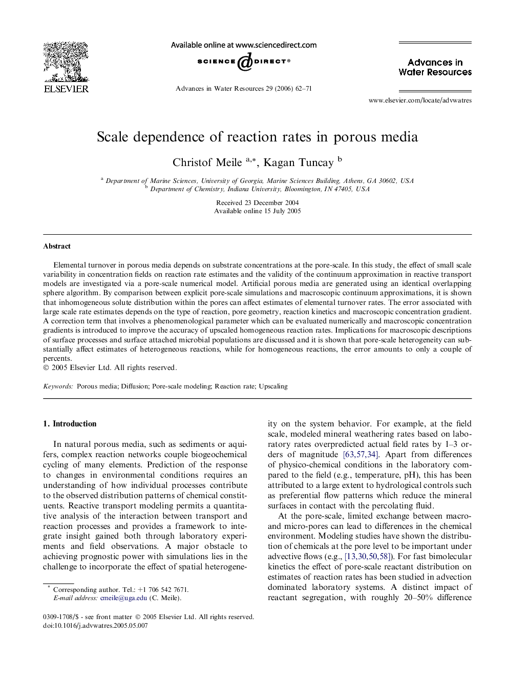 Scale dependence of reaction rates in porous media