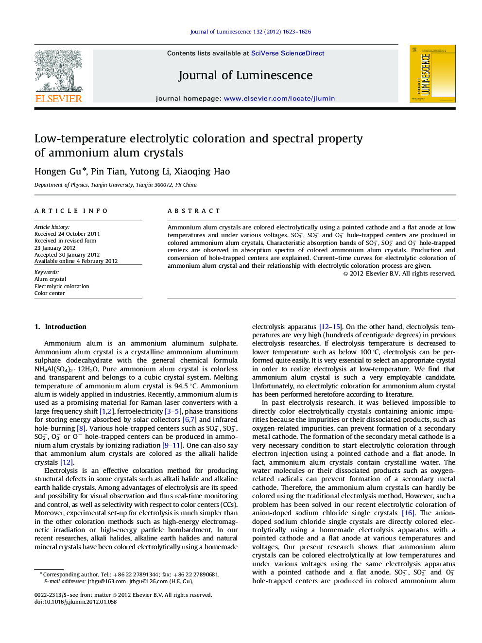 Low-temperature electrolytic coloration and spectral property of ammonium alum crystals