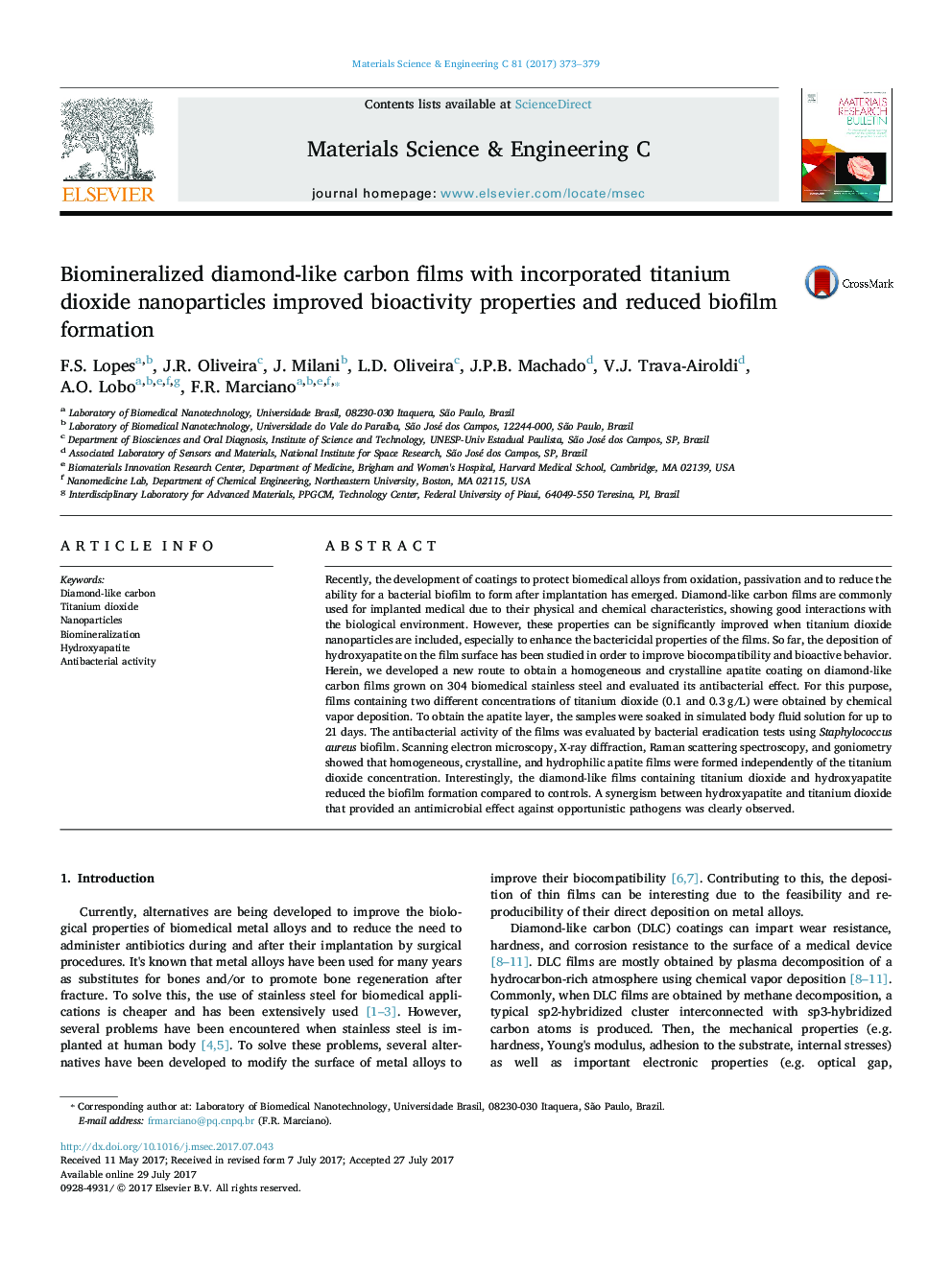 Biomineralized diamond-like carbon films with incorporated titanium dioxide nanoparticles improved bioactivity properties and reduced biofilm formation