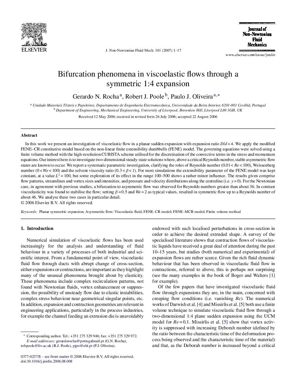 Bifurcation phenomena in viscoelastic flows through a symmetric 1:4 expansion