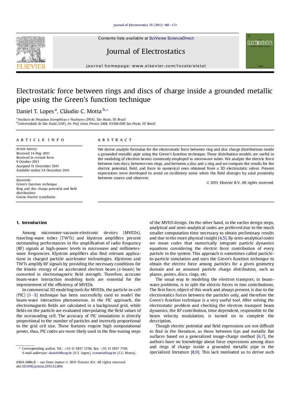 Electrostatic force between rings and discs of charge inside a grounded metallic pipe using the Green’s function technique