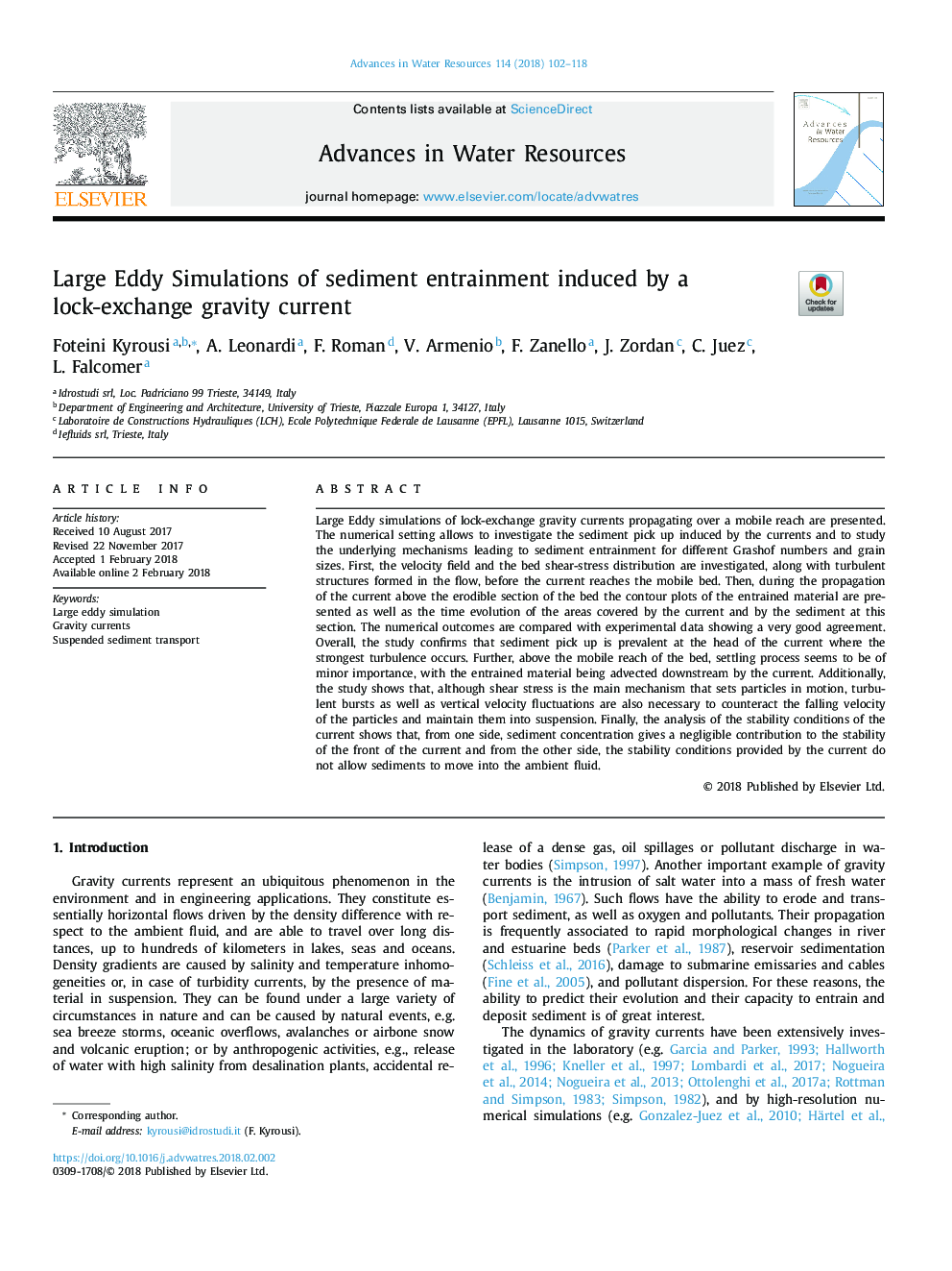 Large Eddy Simulations of sediment entrainment induced by a lock-exchange gravity current