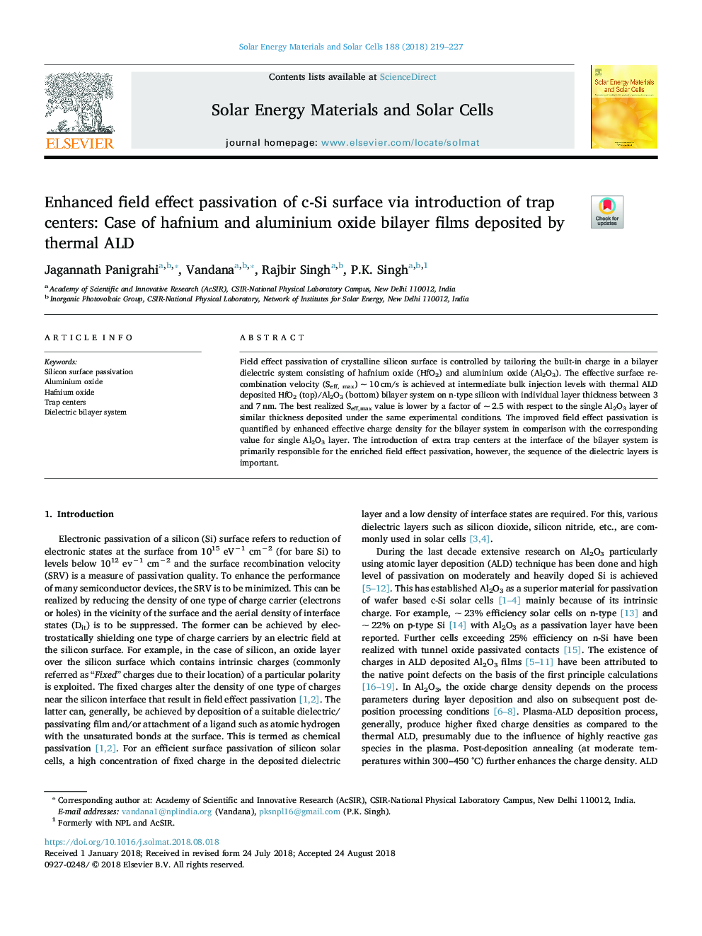 Enhanced field effect passivation of c-Si surface via introduction of trap centers: Case of hafnium and aluminium oxide bilayer films deposited by thermal ALD