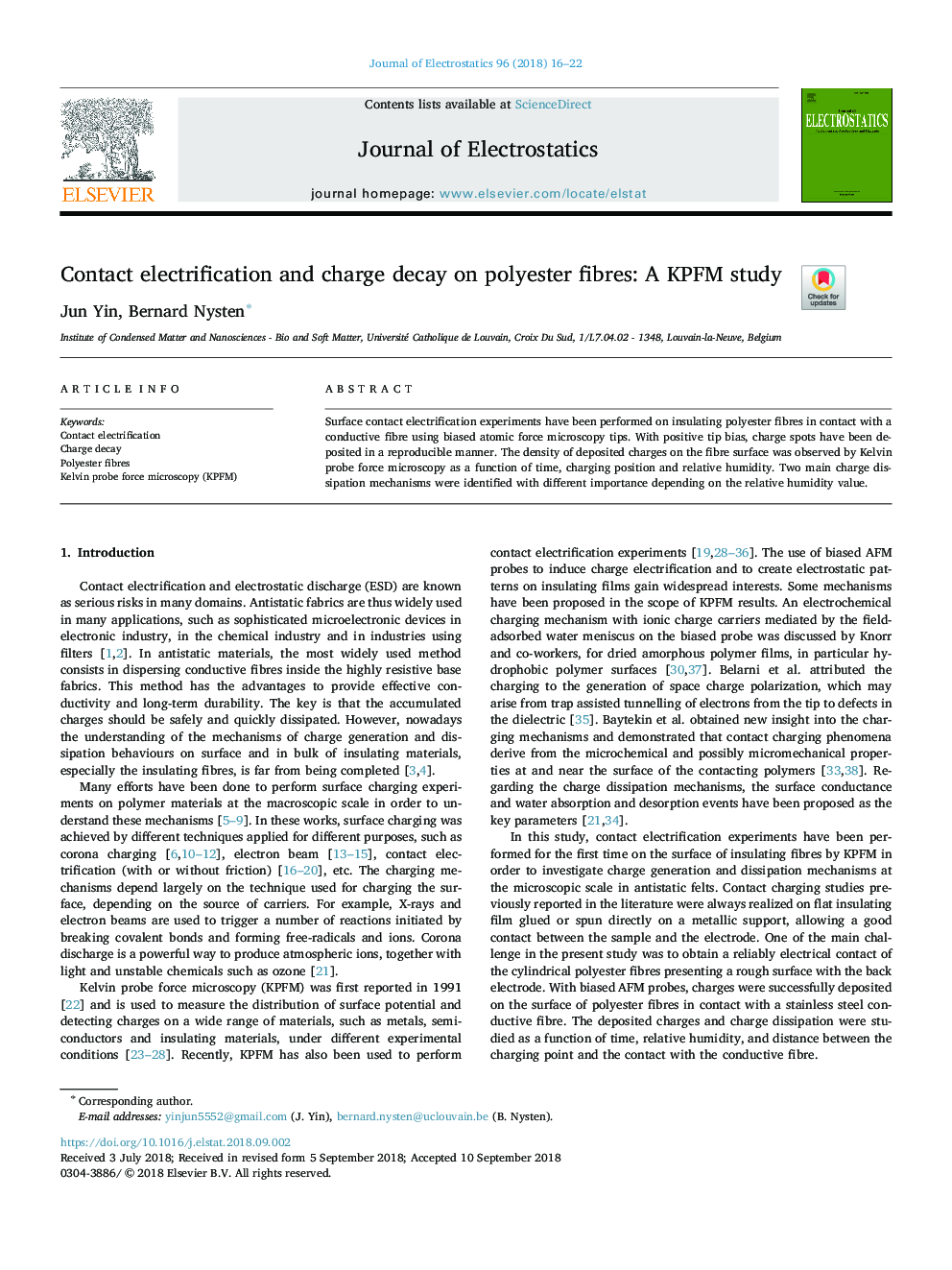 Contact electrification and charge decay on polyester fibres: A KPFM study