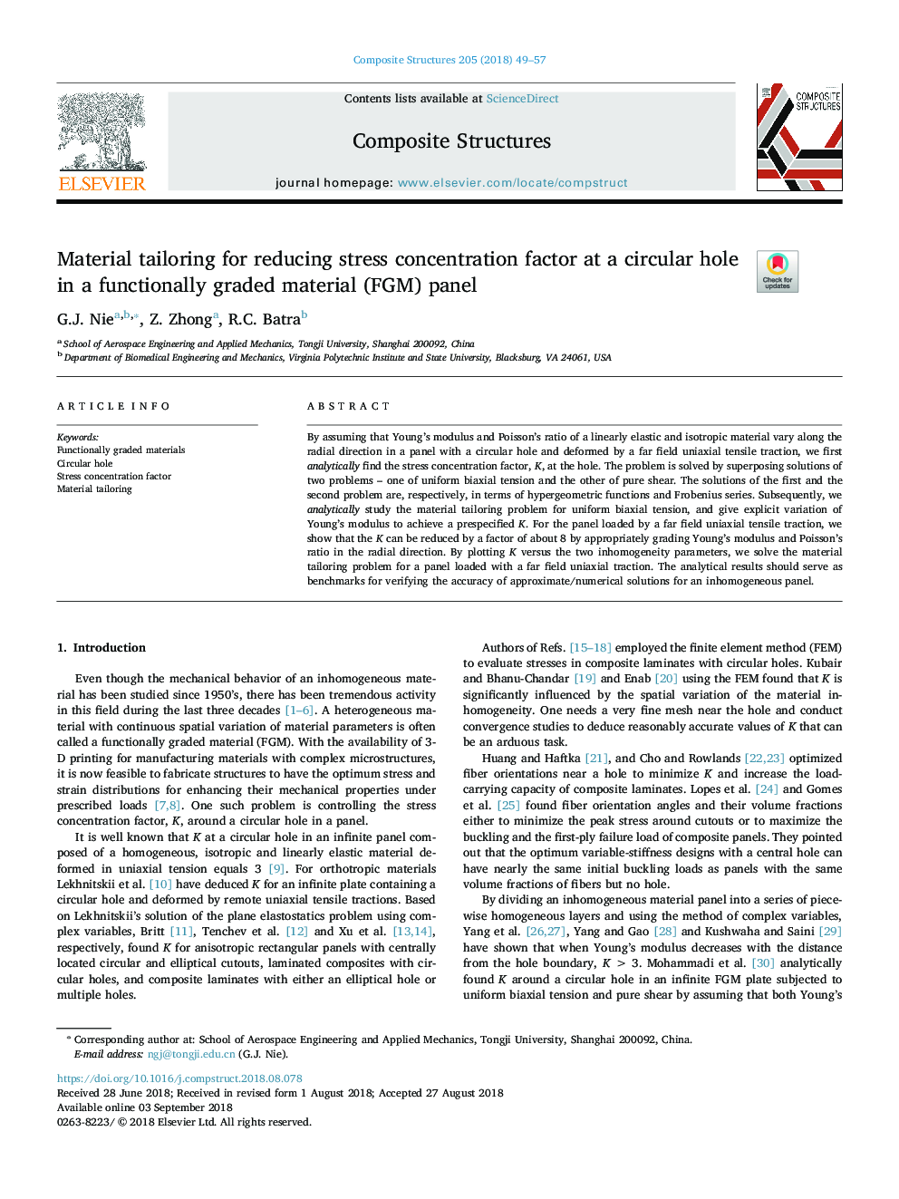 Material tailoring for reducing stress concentration factor at a circular hole in a functionally graded material (FGM) panel