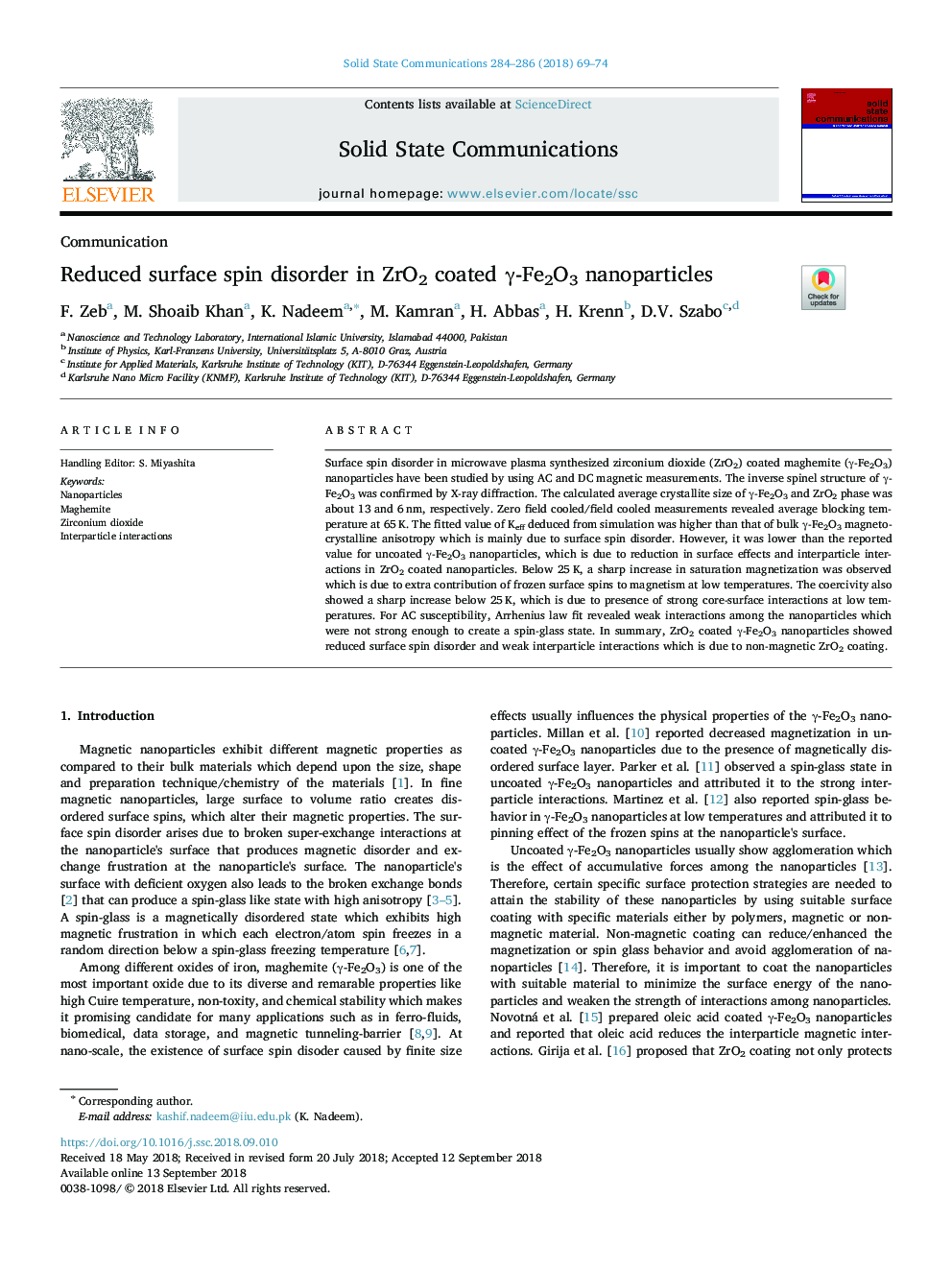 Reduced surface spin disorder in ZrO2 coated Î³-Fe2O3 nanoparticles