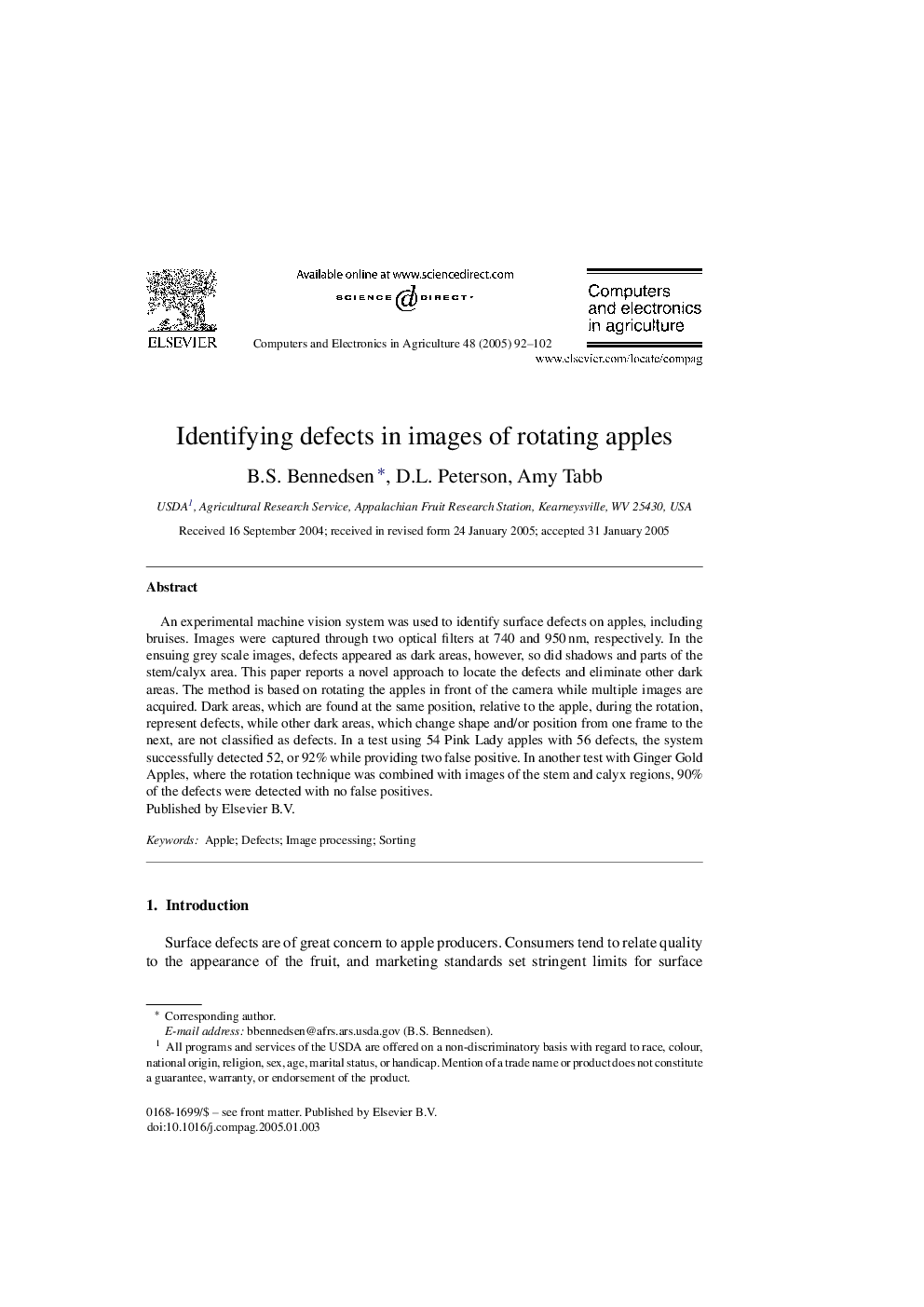 Identifying defects in images of rotating apples