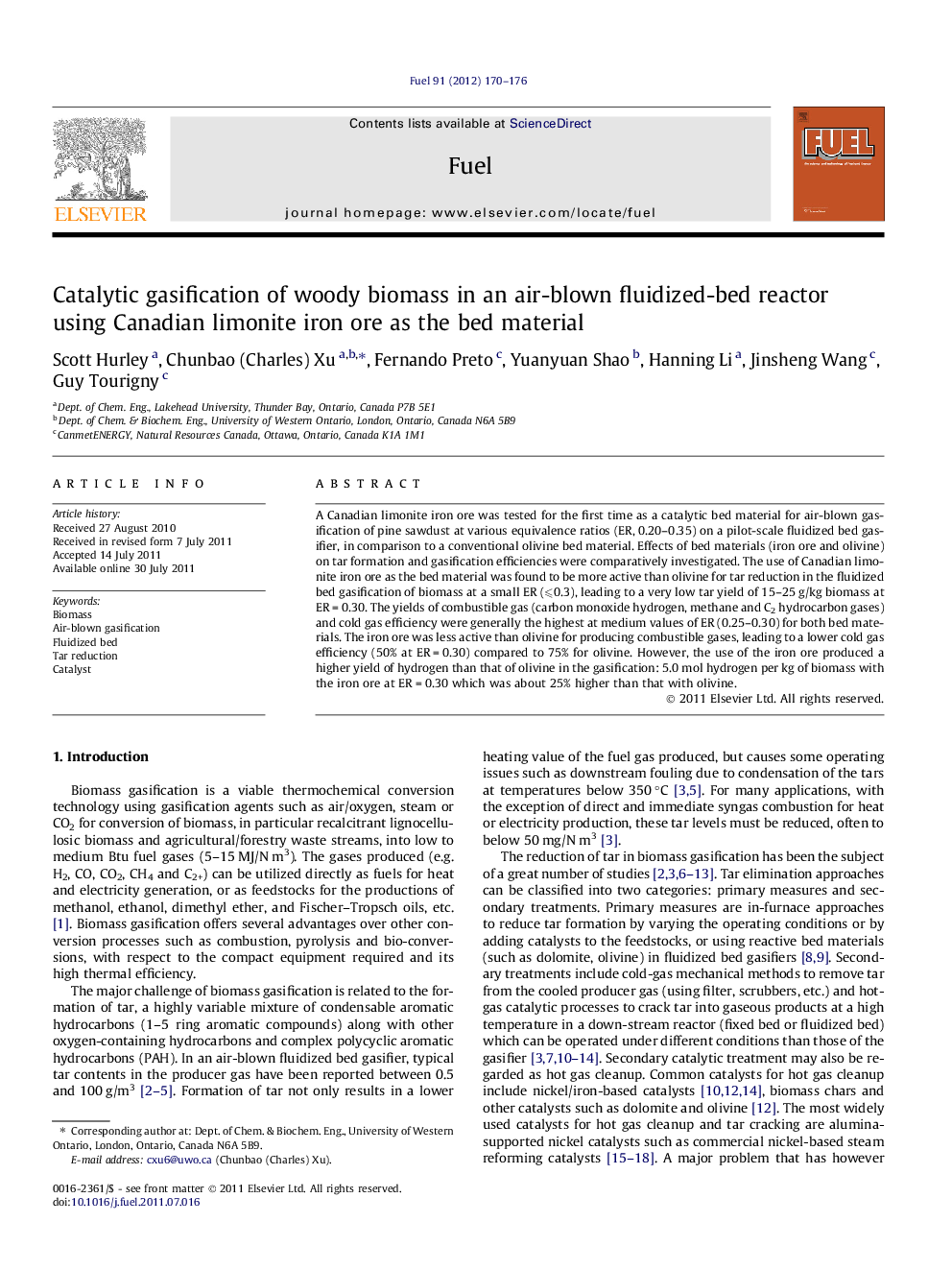 Catalytic gasification of woody biomass in an air-blown fluidized-bed reactor using Canadian limonite iron ore as the bed material