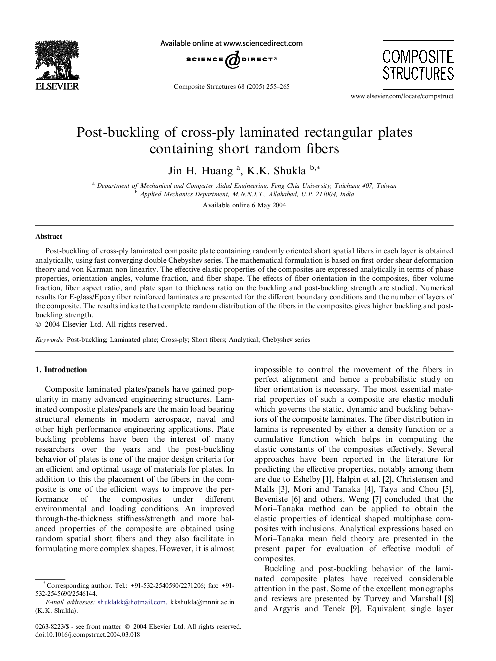 Post-buckling of cross-ply laminated rectangular plates containing short random fibers