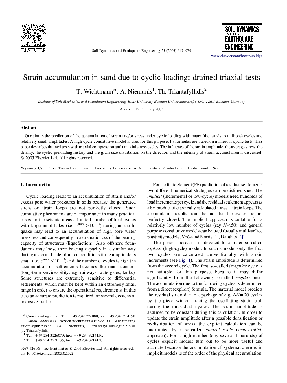 Strain accumulation in sand due to cyclic loading: drained triaxial tests