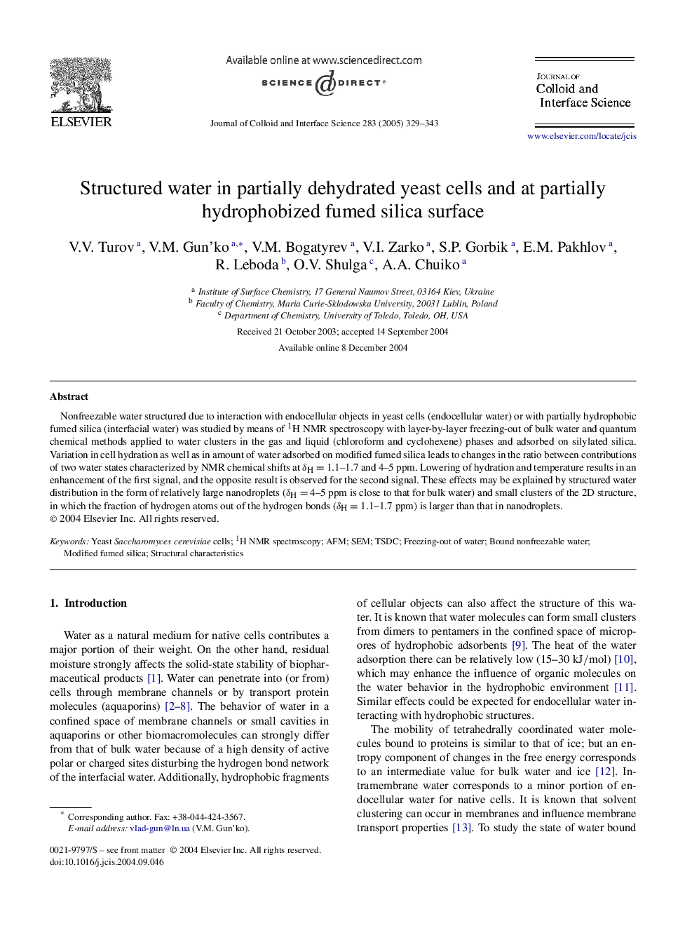 Structured water in partially dehydrated yeast cells and at partially hydrophobized fumed silica surface