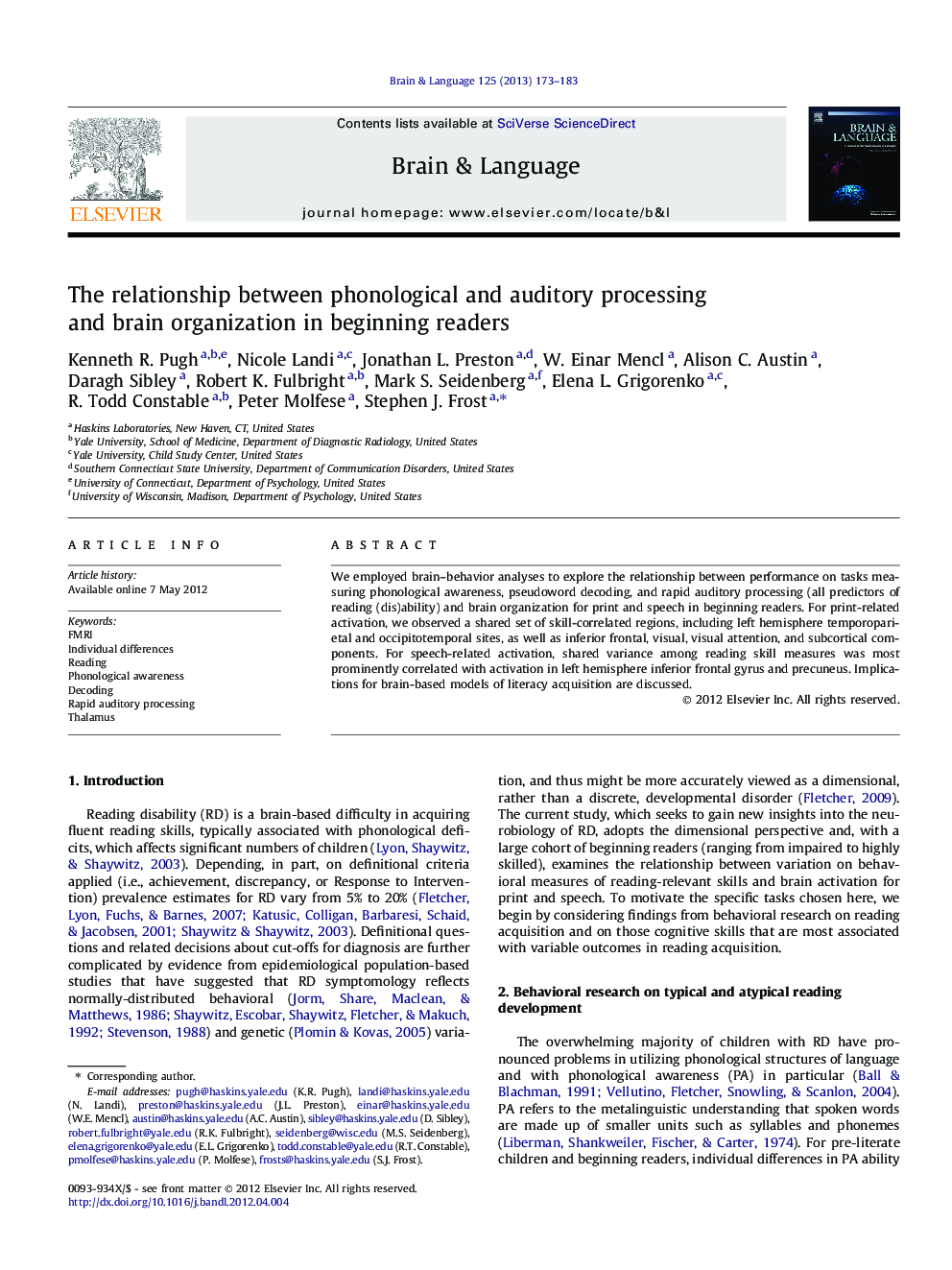 The relationship between phonological and auditory processing and brain organization in beginning readers