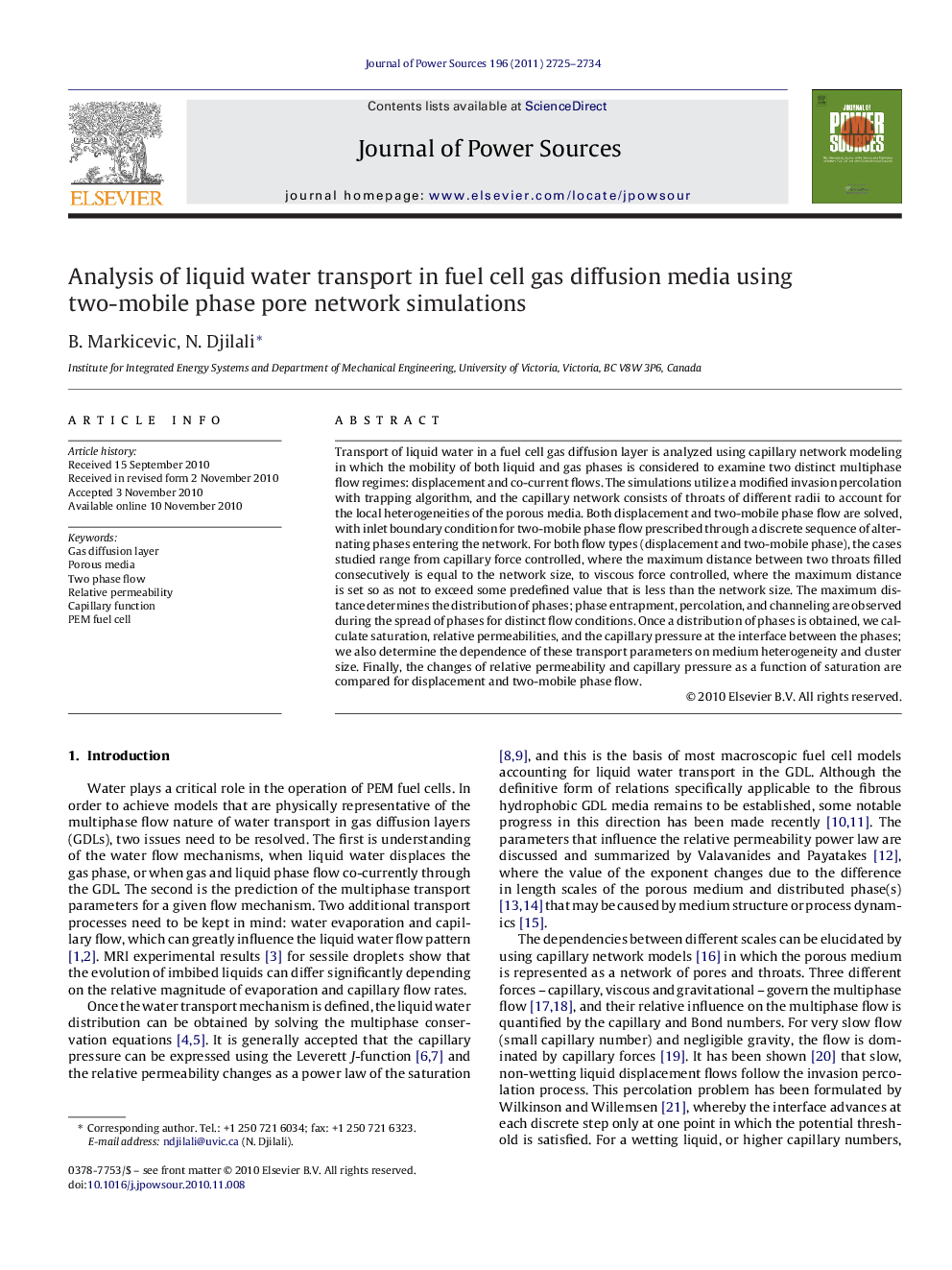 Analysis of liquid water transport in fuel cell gas diffusion media using two-mobile phase pore network simulations