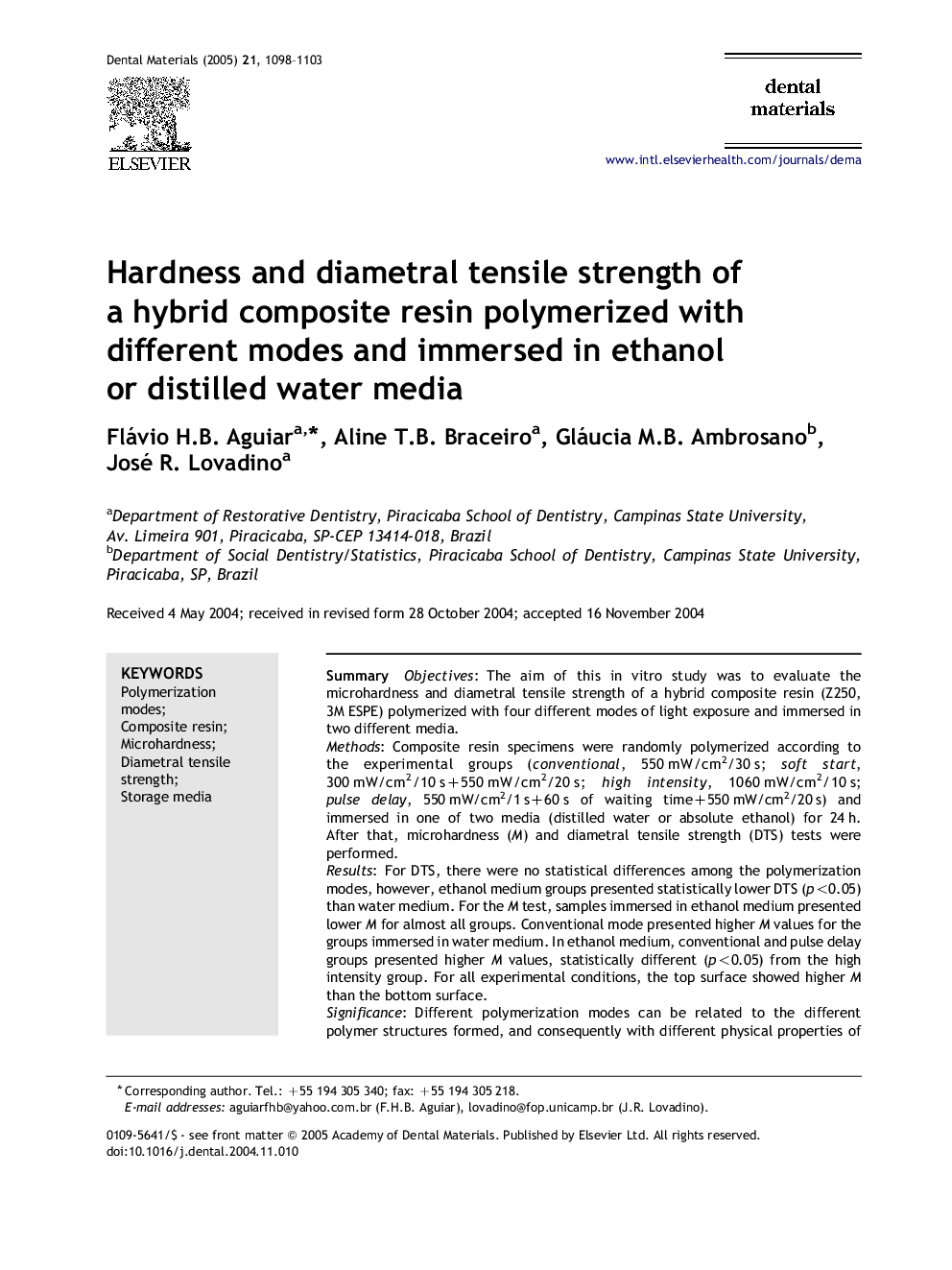 Hardness and diametral tensile strength of a hybrid composite resin polymerized with different modes and immersed in ethanol or distilled water media