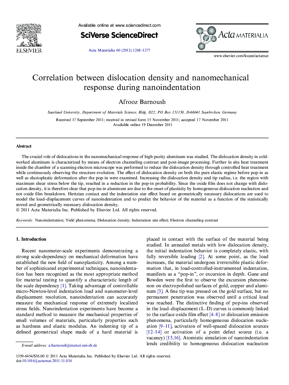 Correlation between dislocation density and nanomechanical response during nanoindentation