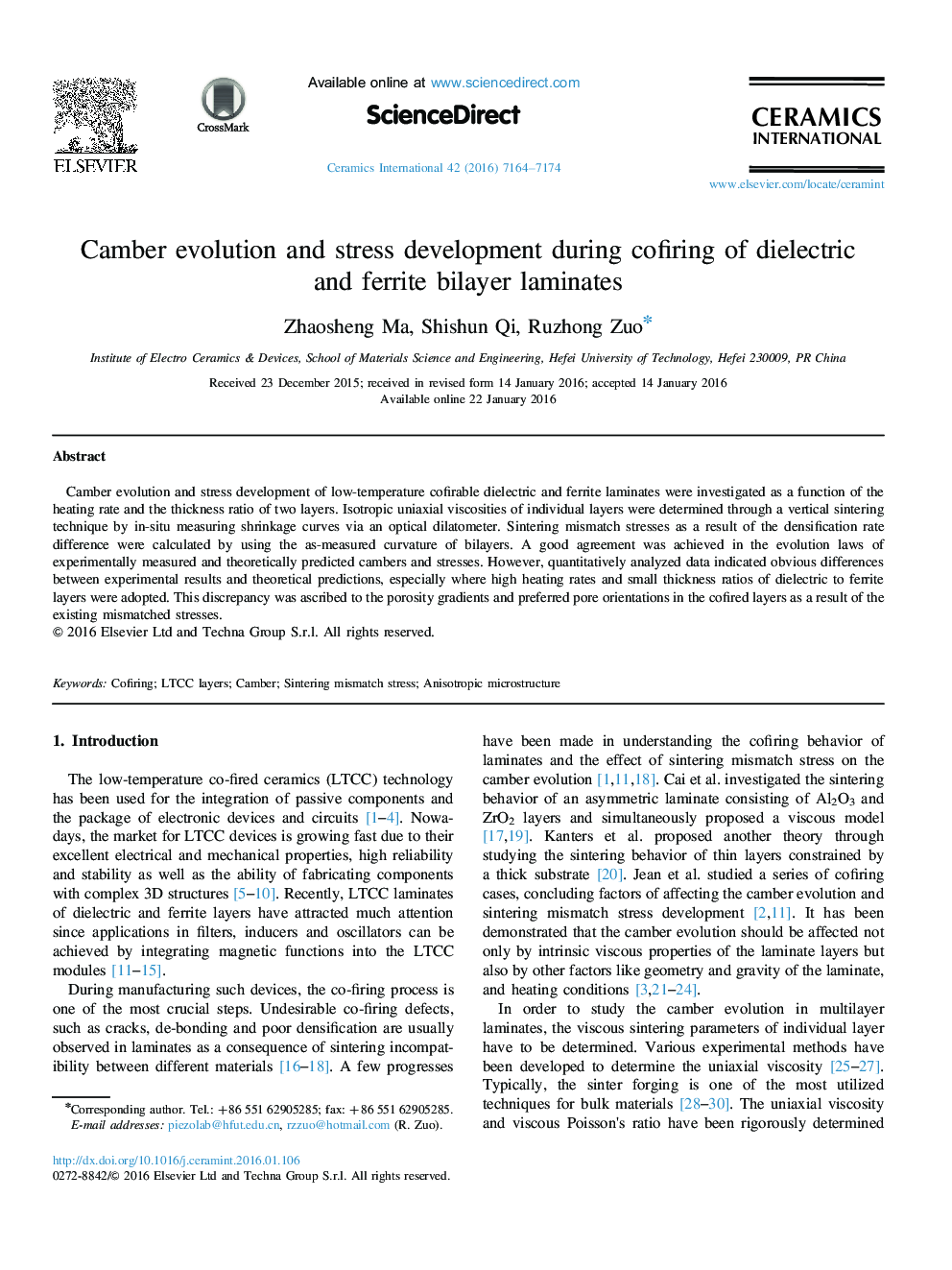 Camber evolution and stress development during cofiring of dielectric and ferrite bilayer laminates