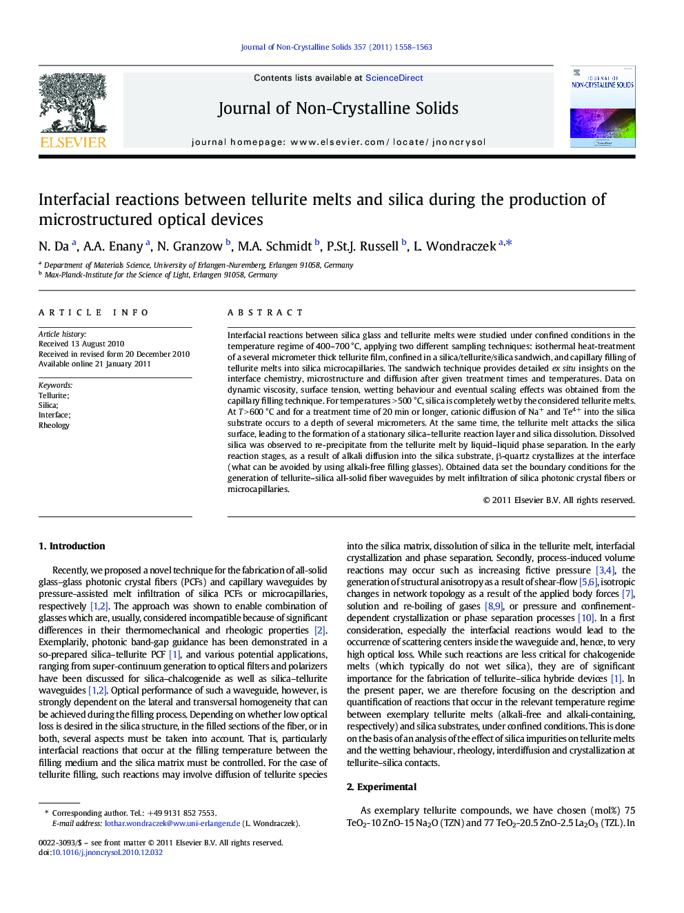 Interfacial reactions between tellurite melts and silica during the production of microstructured optical devices