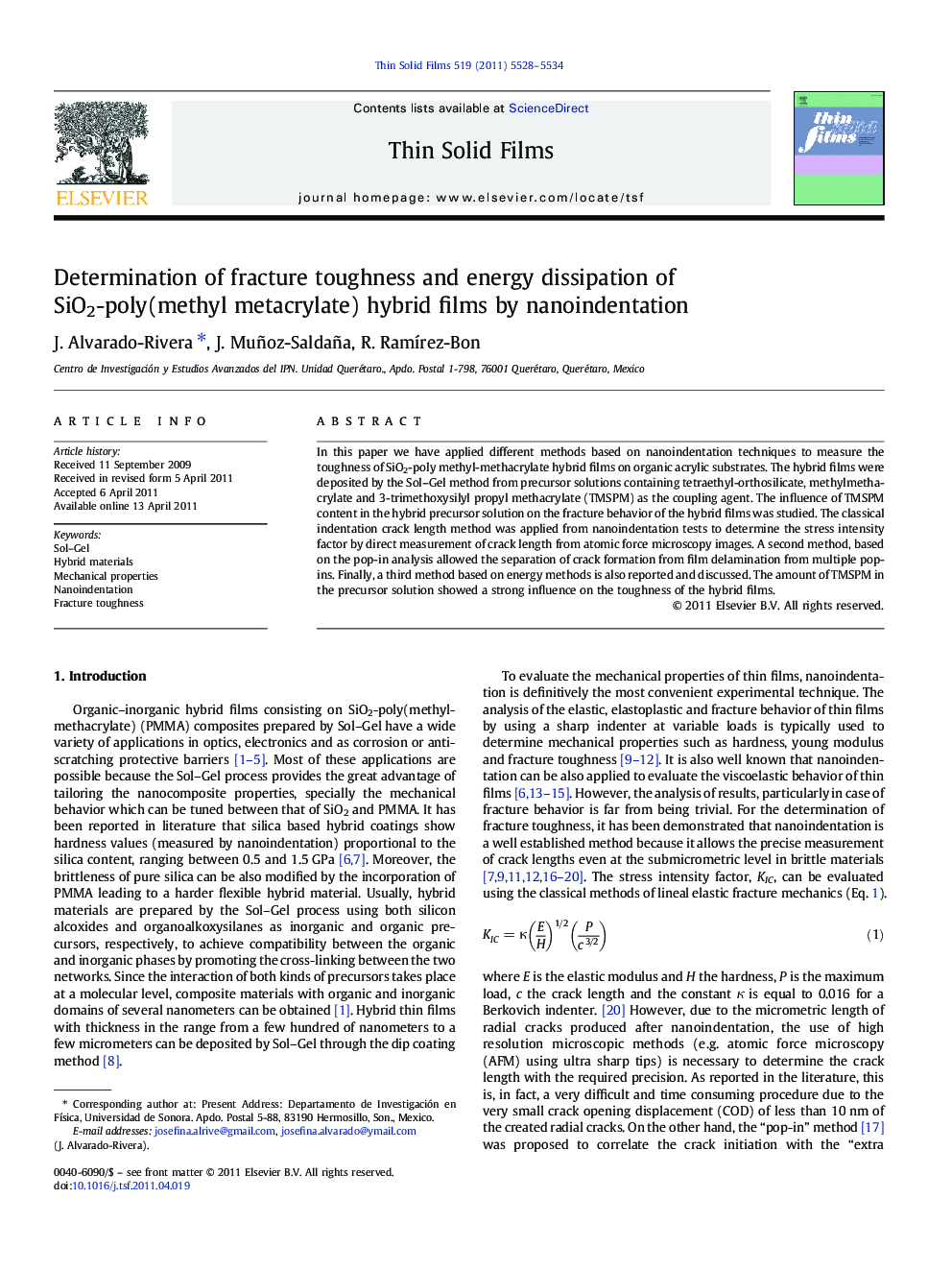 Determination of fracture toughness and energy dissipation of SiO2-poly(methyl metacrylate) hybrid films by nanoindentation