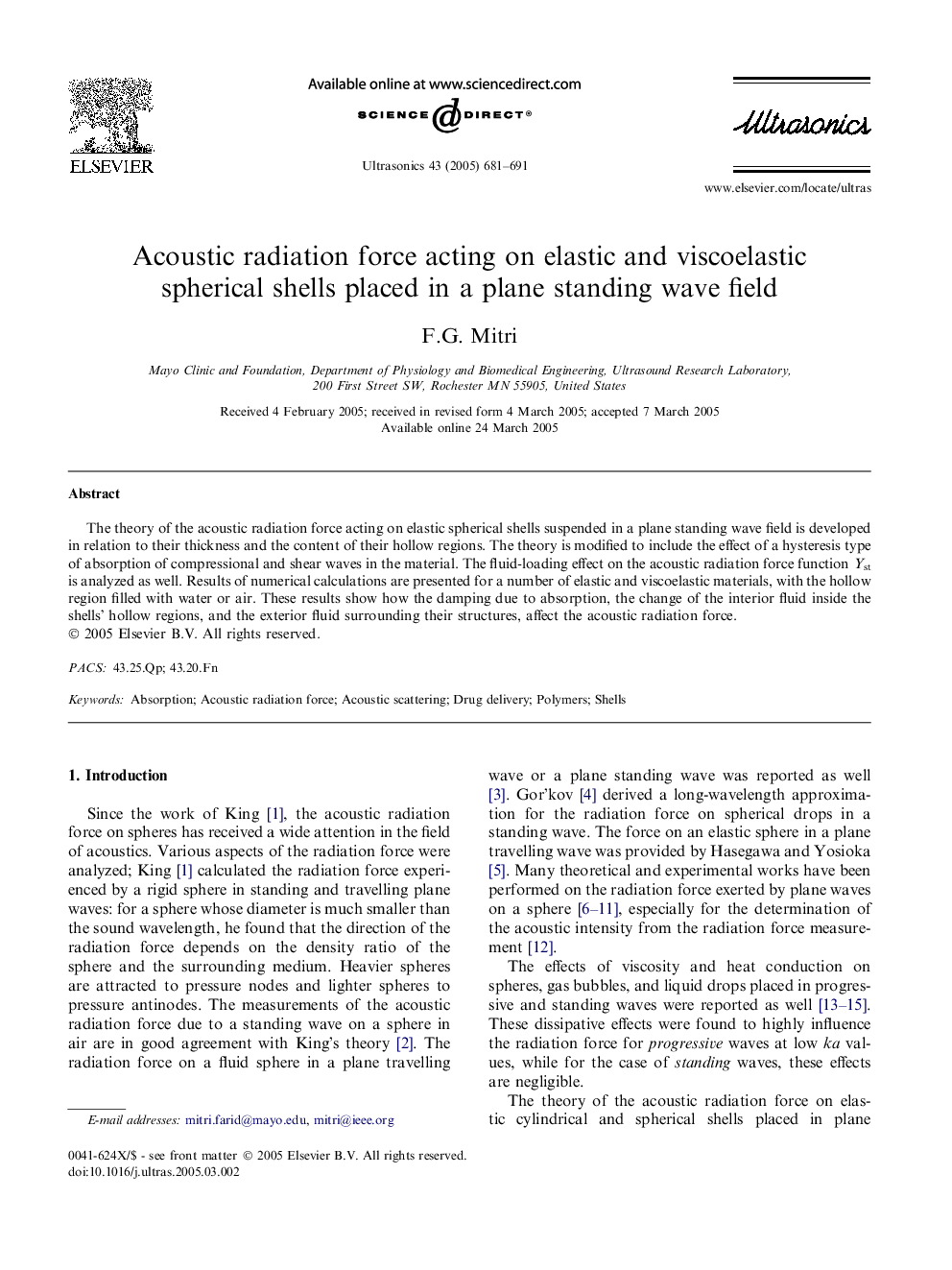 Acoustic radiation force acting on elastic and viscoelastic spherical shells placed in a plane standing wave field