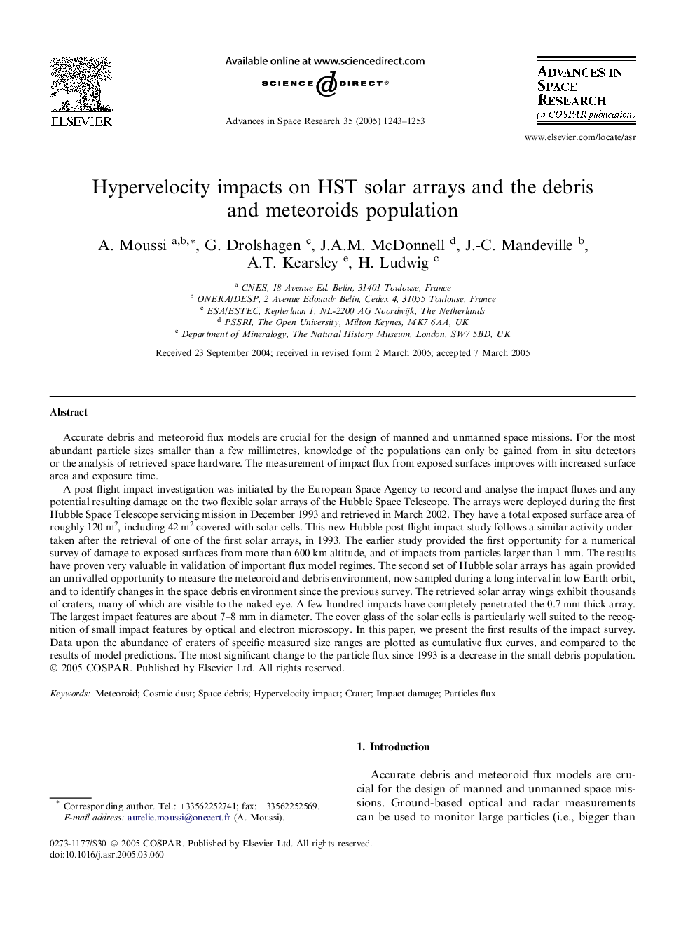 Hypervelocity impacts on HST solar arrays and the debris and meteoroids population