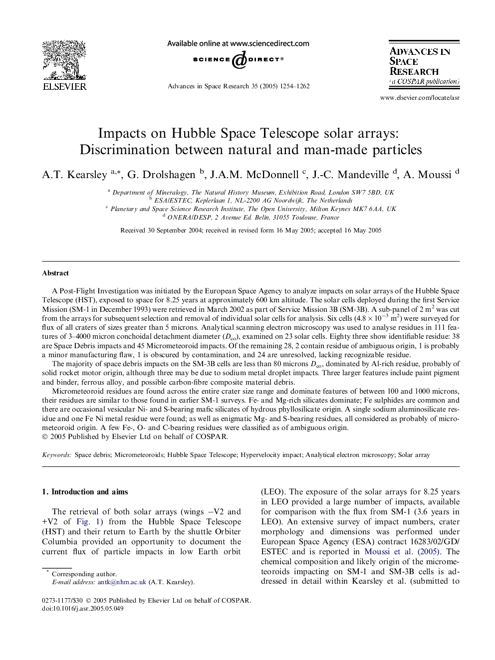 Impacts on Hubble Space Telescope solar arrays: Discrimination between natural and man-made particles