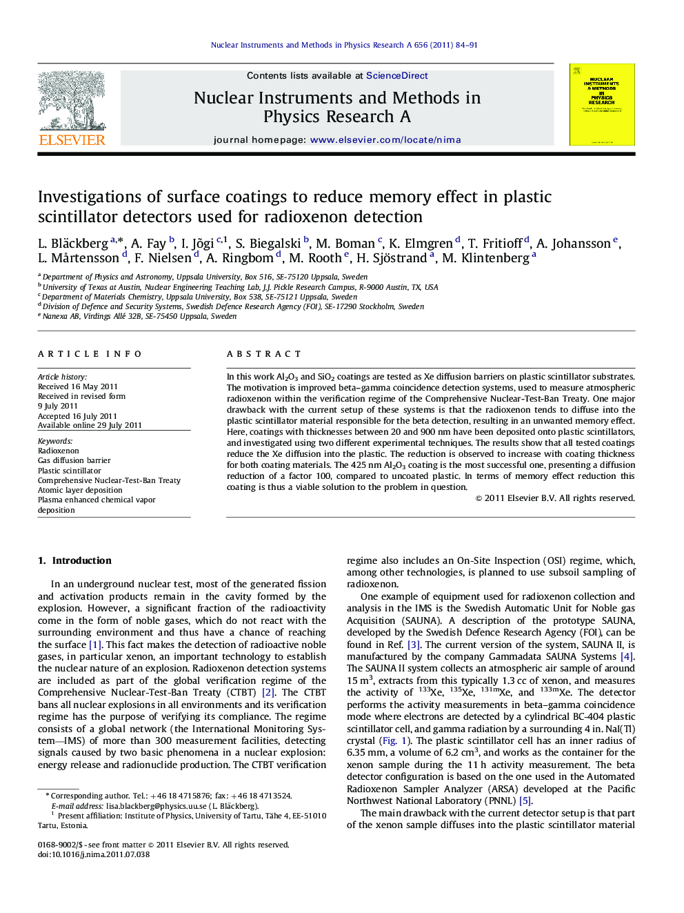 Investigations of surface coatings to reduce memory effect in plastic scintillator detectors used for radioxenon detection