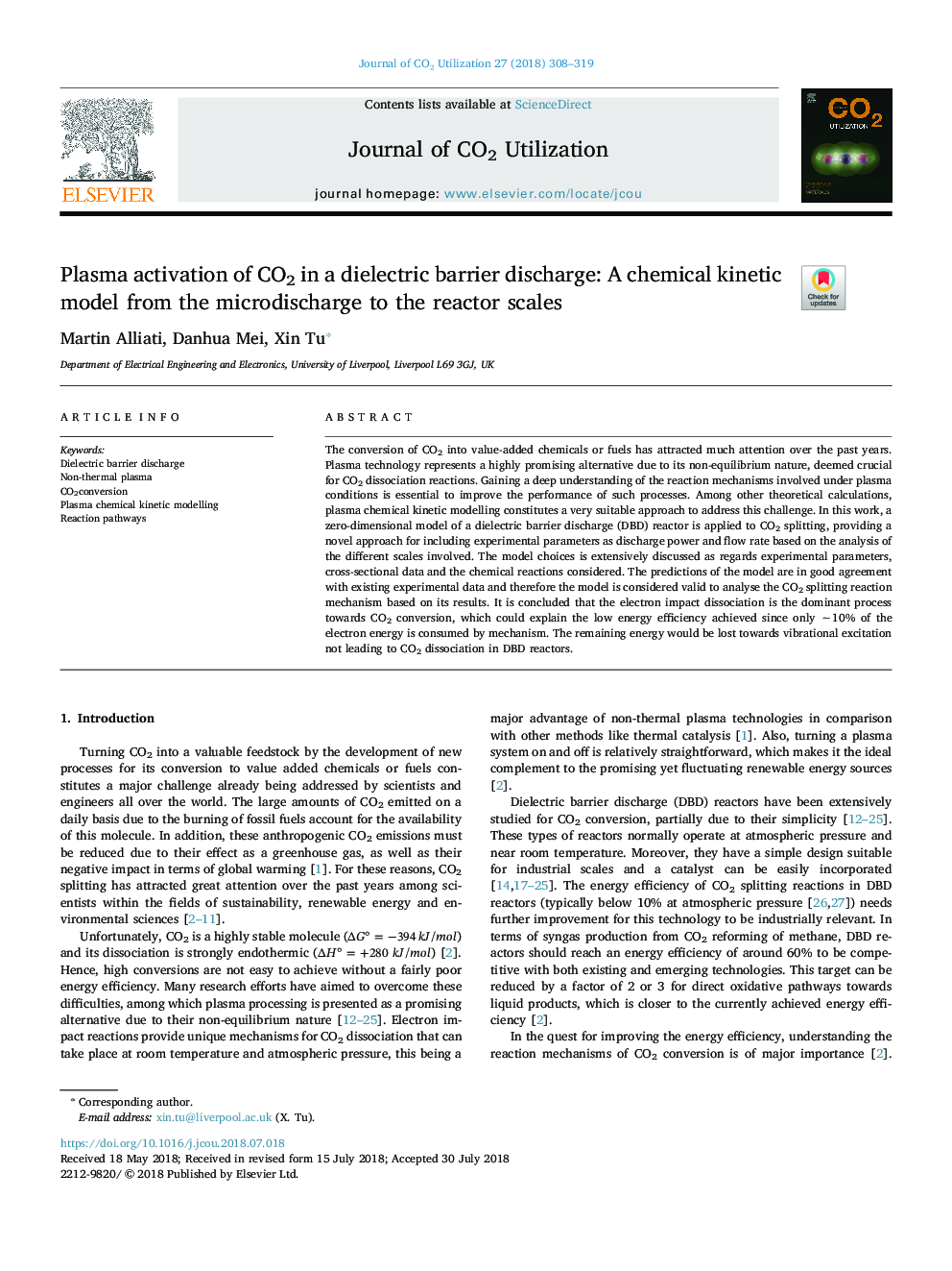 Plasma activation of CO2 in a dielectric barrier discharge: A chemical kinetic model from the microdischarge to the reactor scales