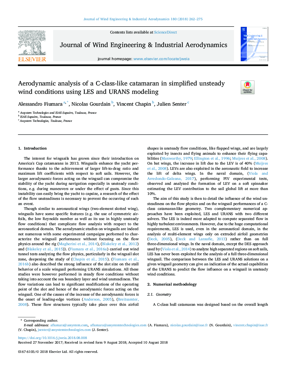 Aerodynamic analysis of a C-class-like catamaran in simplified unsteady wind conditions using LES and URANS modeling
