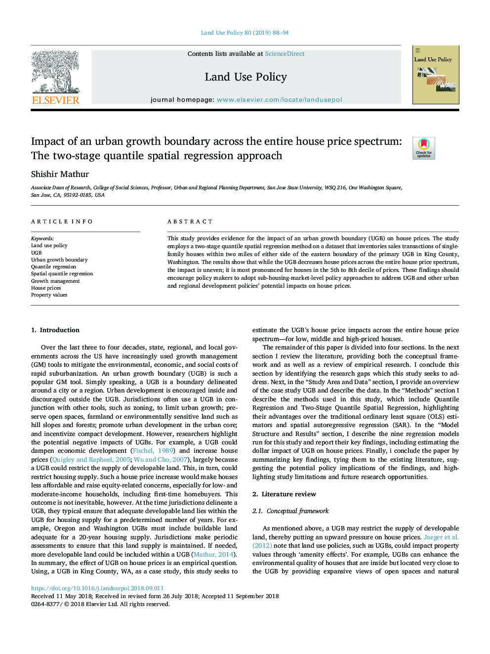 Impact of an urban growth boundary across the entire house price spectrum: The two-stage quantile spatial regression approach