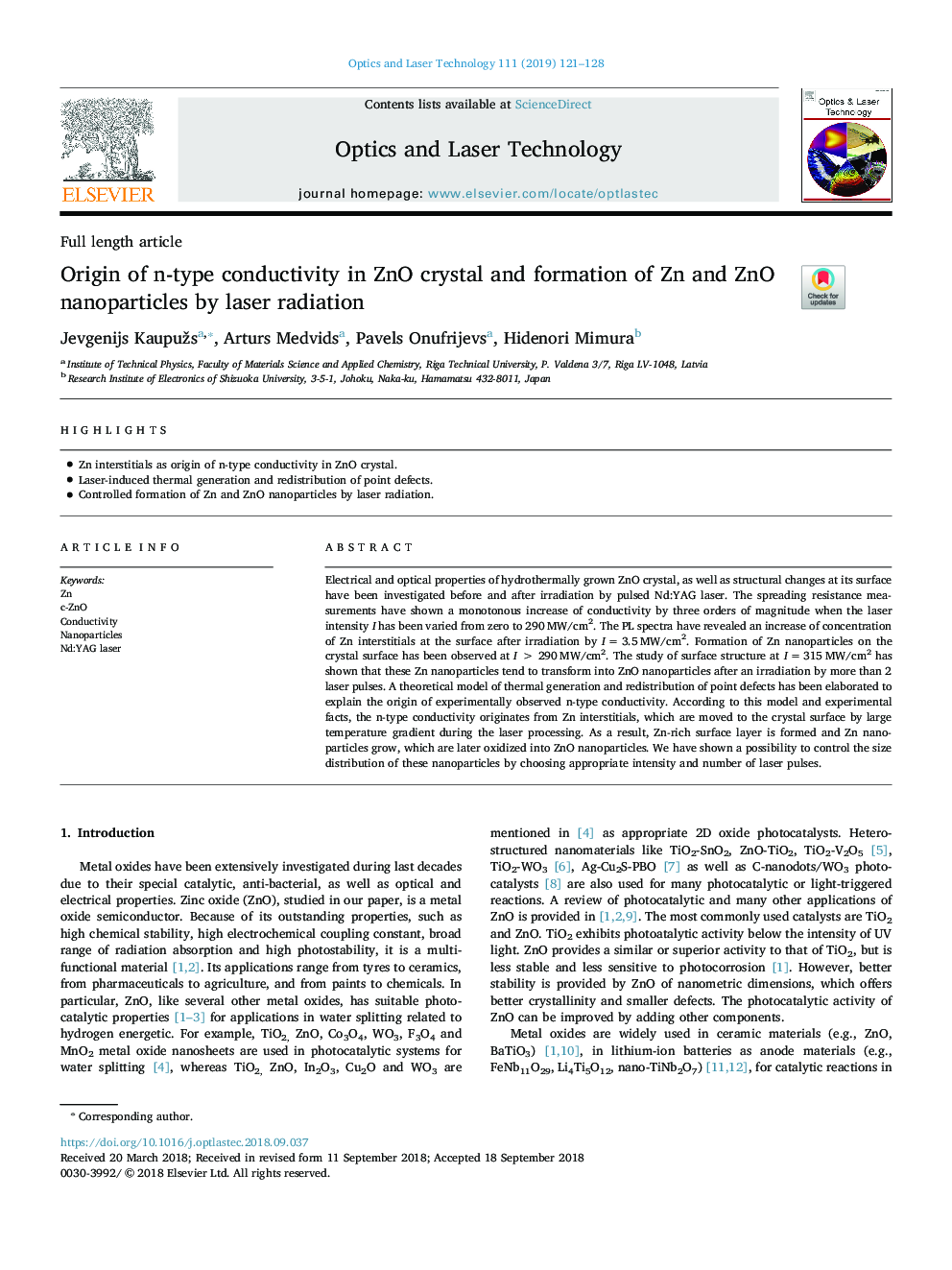 Origin of n-type conductivity in ZnO crystal and formation of Zn and ZnO nanoparticles by laser radiation