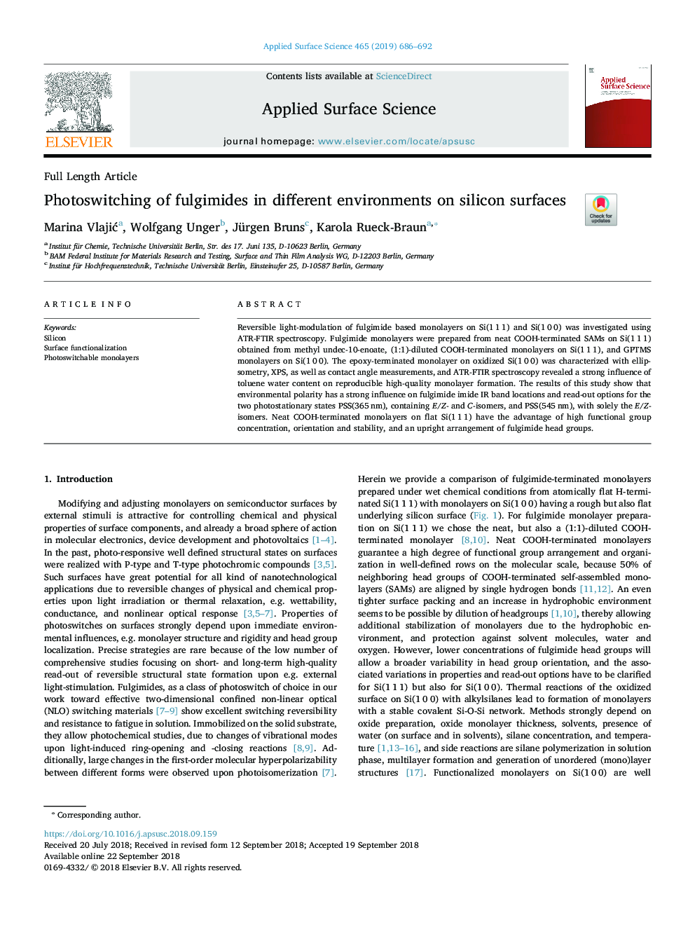 Photoswitching of fulgimides in different environments on silicon surfaces