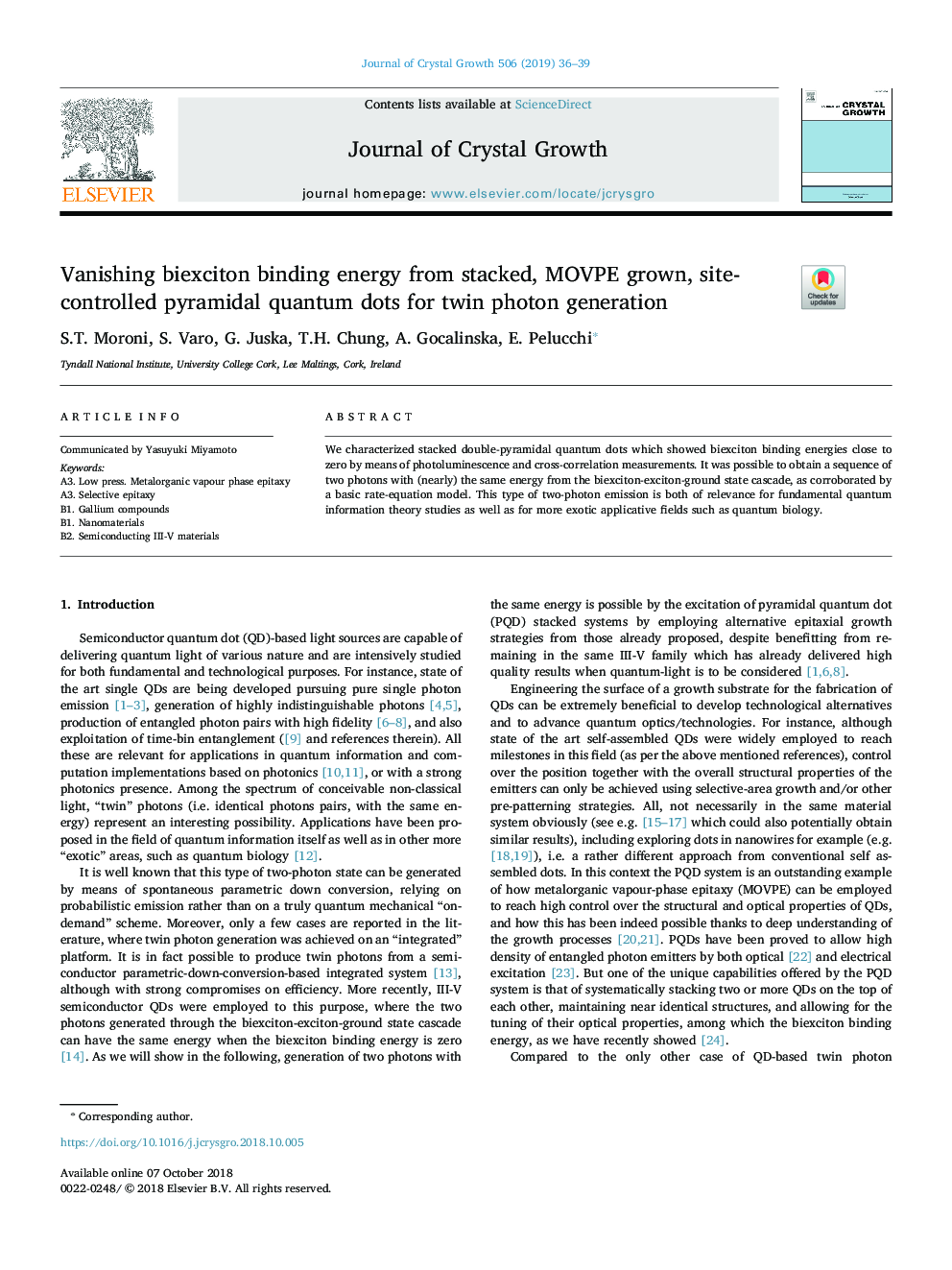 Vanishing biexciton binding energy from stacked, MOVPE grown, site-controlled pyramidal quantum dots for twin photon generation