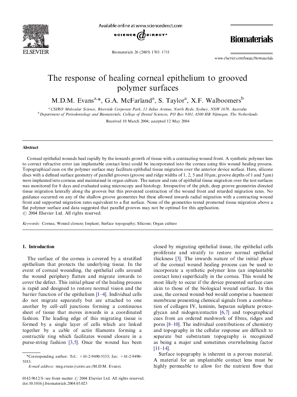 The response of healing corneal epithelium to grooved polymer surfaces