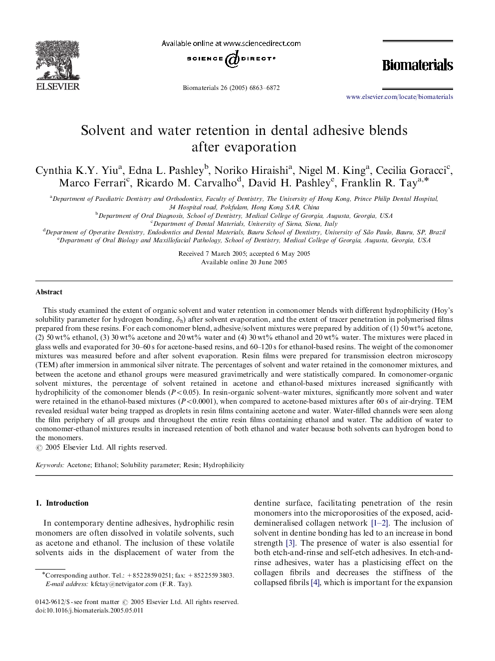 Solvent and water retention in dental adhesive blends after evaporation