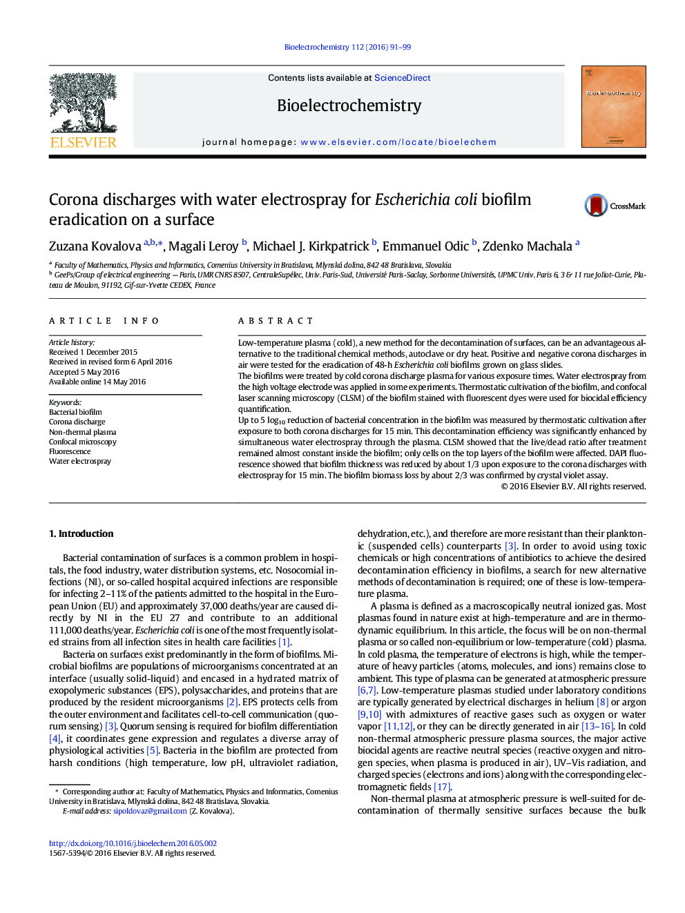 Corona discharges with water electrospray for Escherichia coli biofilm eradication on a surface