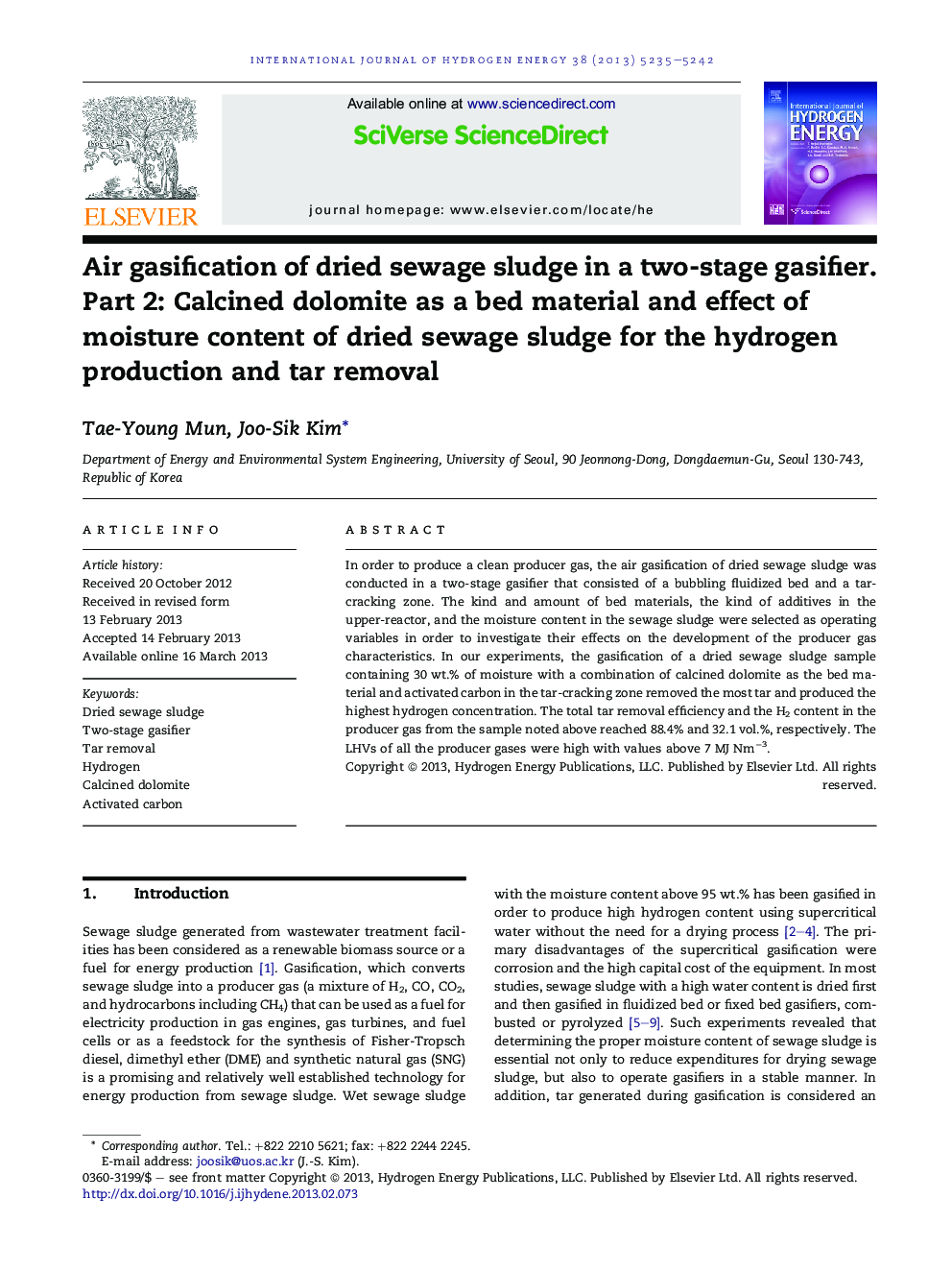 Air gasification of dried sewage sludge in a two-stage gasifier. Part 2: Calcined dolomite as a bed material and effect of moisture content of dried sewage sludge for the hydrogen production and tar removal