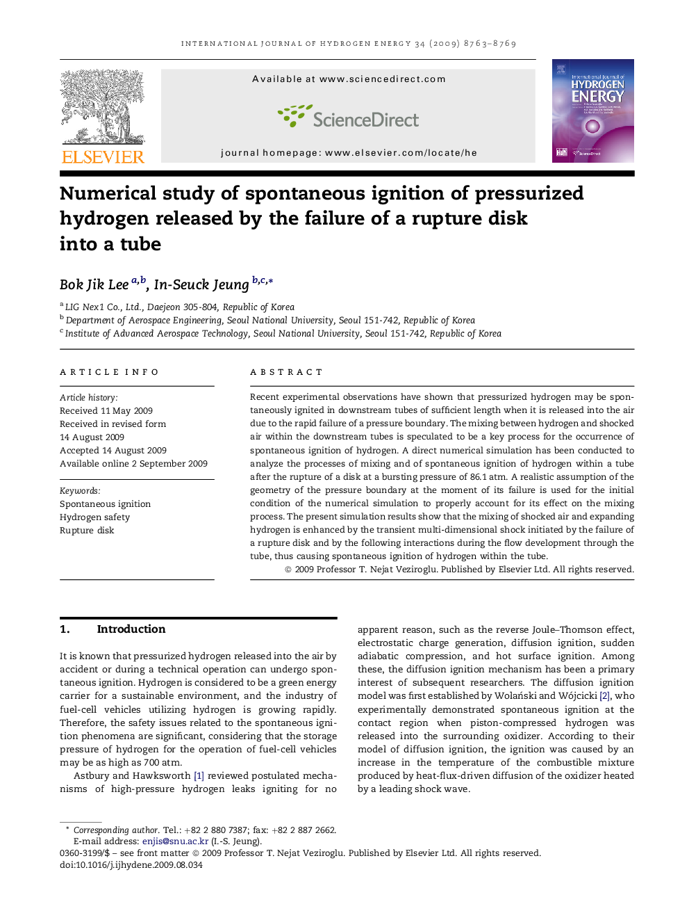 Numerical study of spontaneous ignition of pressurized hydrogen released by the failure of a rupture disk into a tube