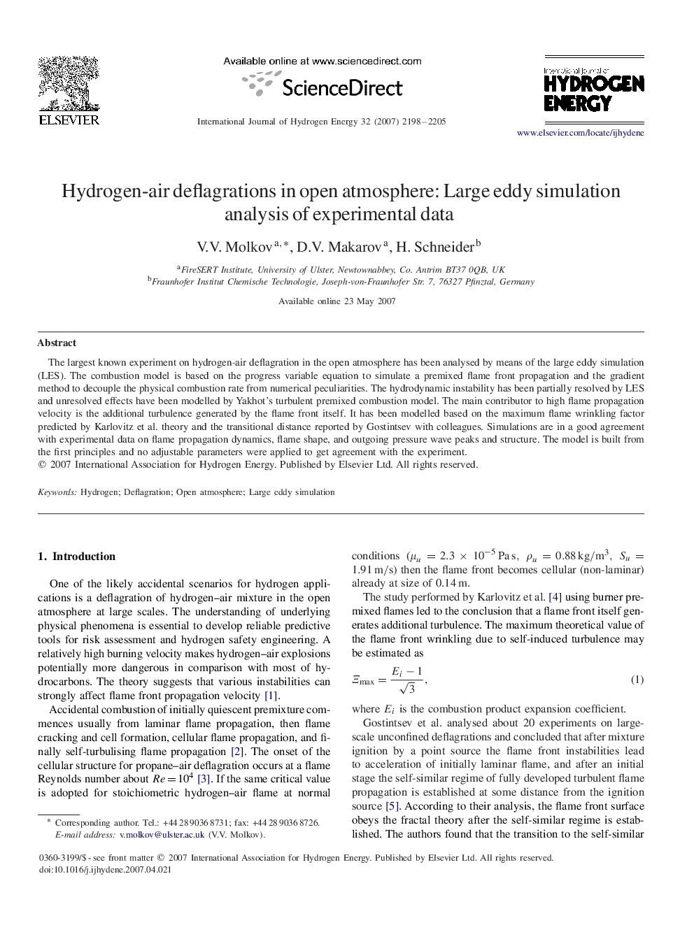 Hydrogen-air deflagrations in open atmosphere: Large eddy simulation analysis of experimental data