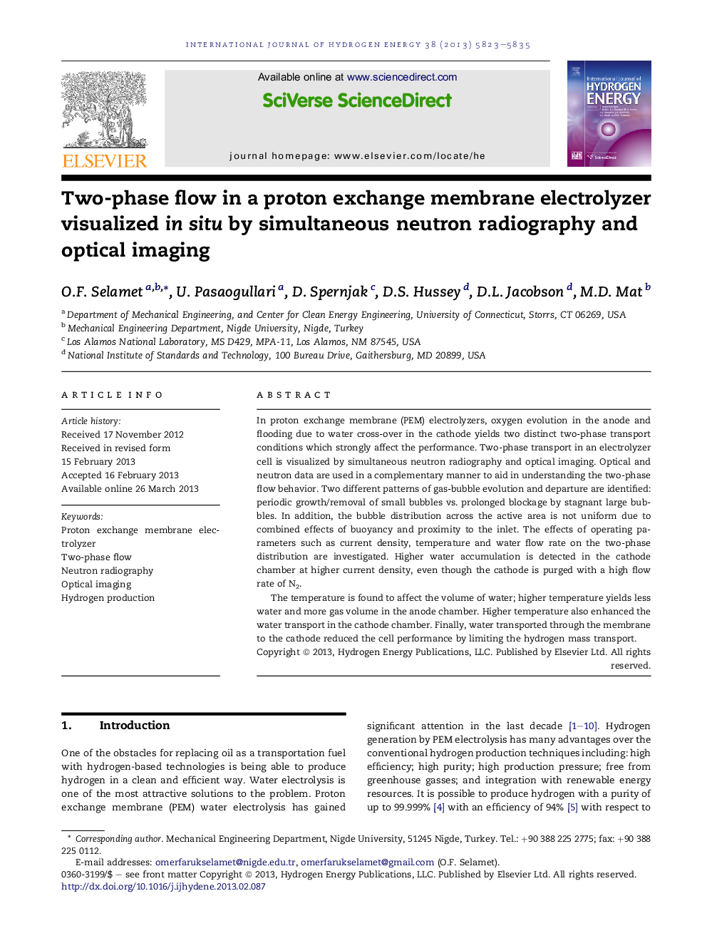 Two-phase flow in a proton exchange membrane electrolyzer visualized in situ by simultaneous neutron radiography and optical imaging