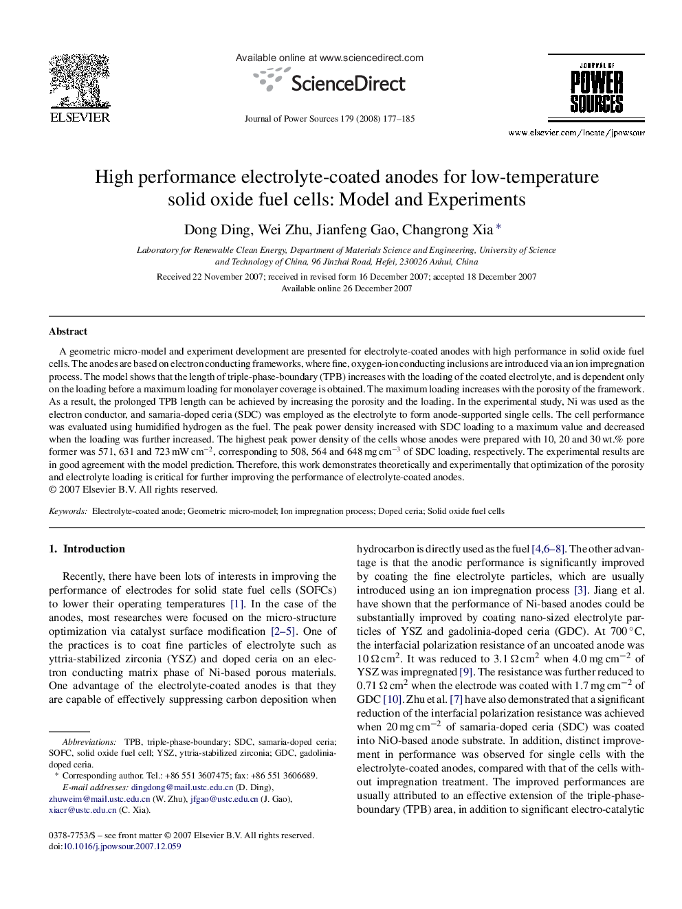 High performance electrolyte-coated anodes for low-temperature solid oxide fuel cells: Model and Experiments