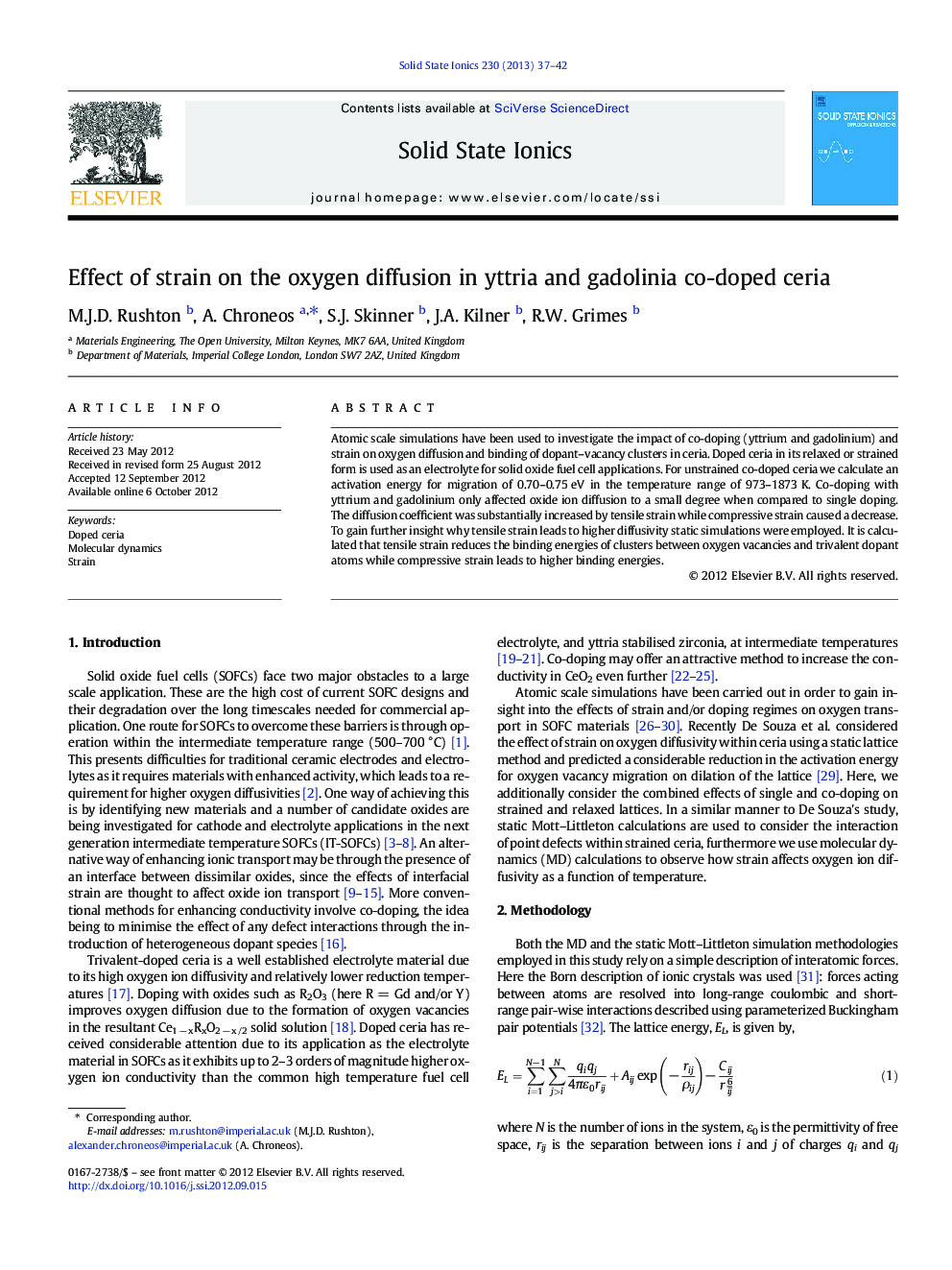 Effect of strain on the oxygen diffusion in yttria and gadolinia co-doped ceria