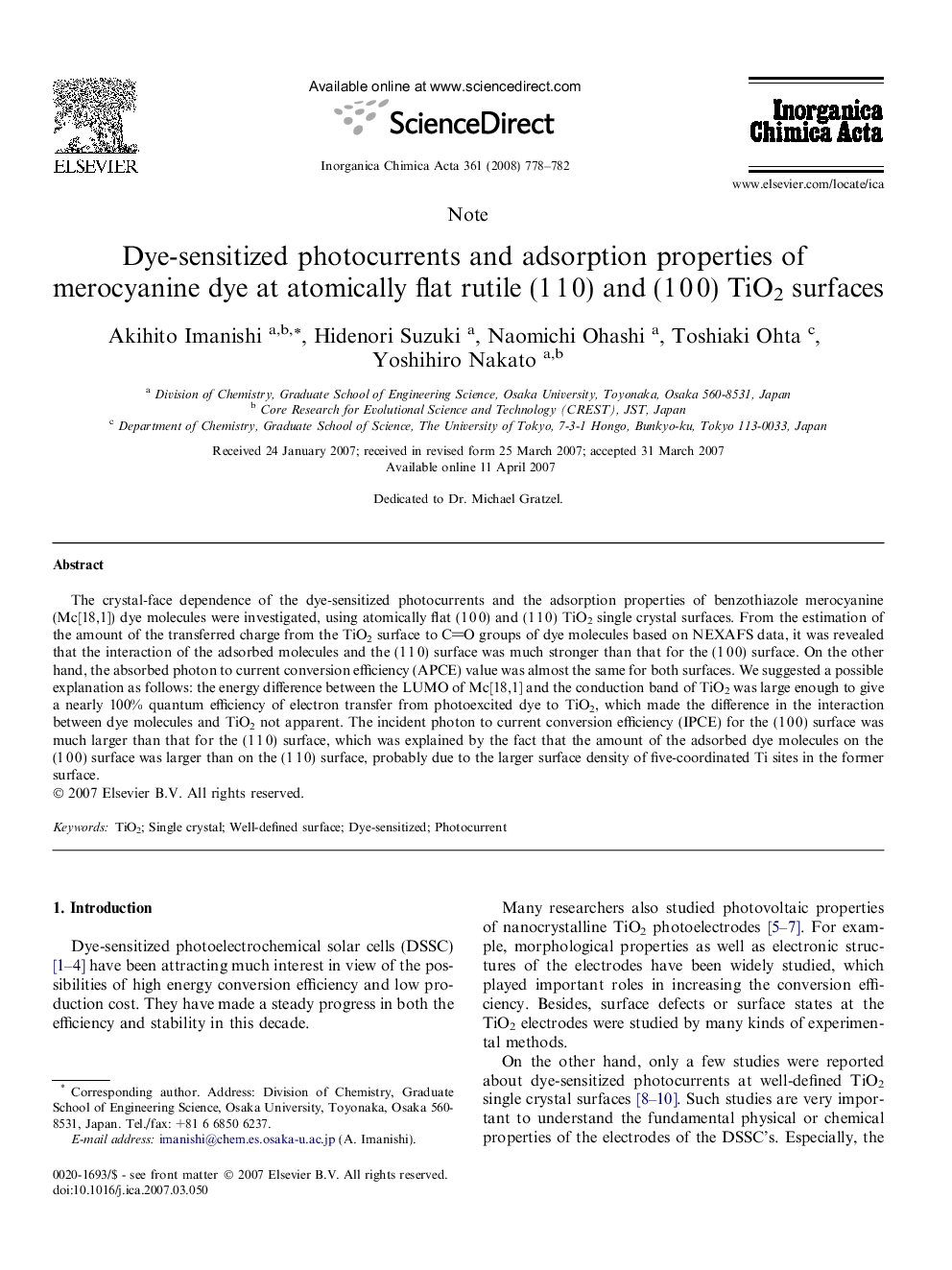 Dye-sensitized photocurrents and adsorption properties of merocyanine dye at atomically flat rutile (1 1 0) and (1 0 0) TiO2 surfaces