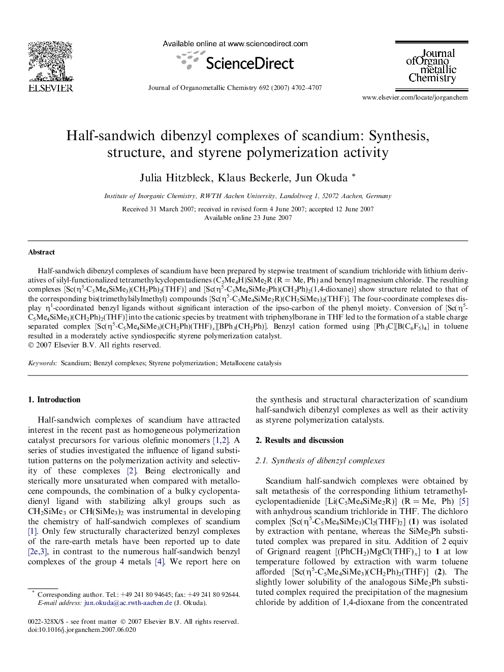 Half-sandwich dibenzyl complexes of scandium: Synthesis, structure, and styrene polymerization activity