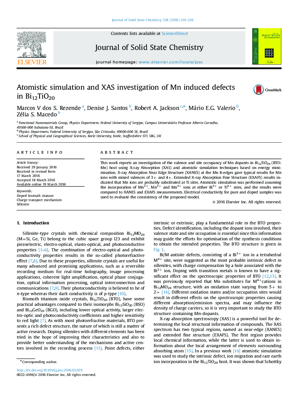Atomistic simulation and XAS investigation of Mn induced defects in Bi12TiO20