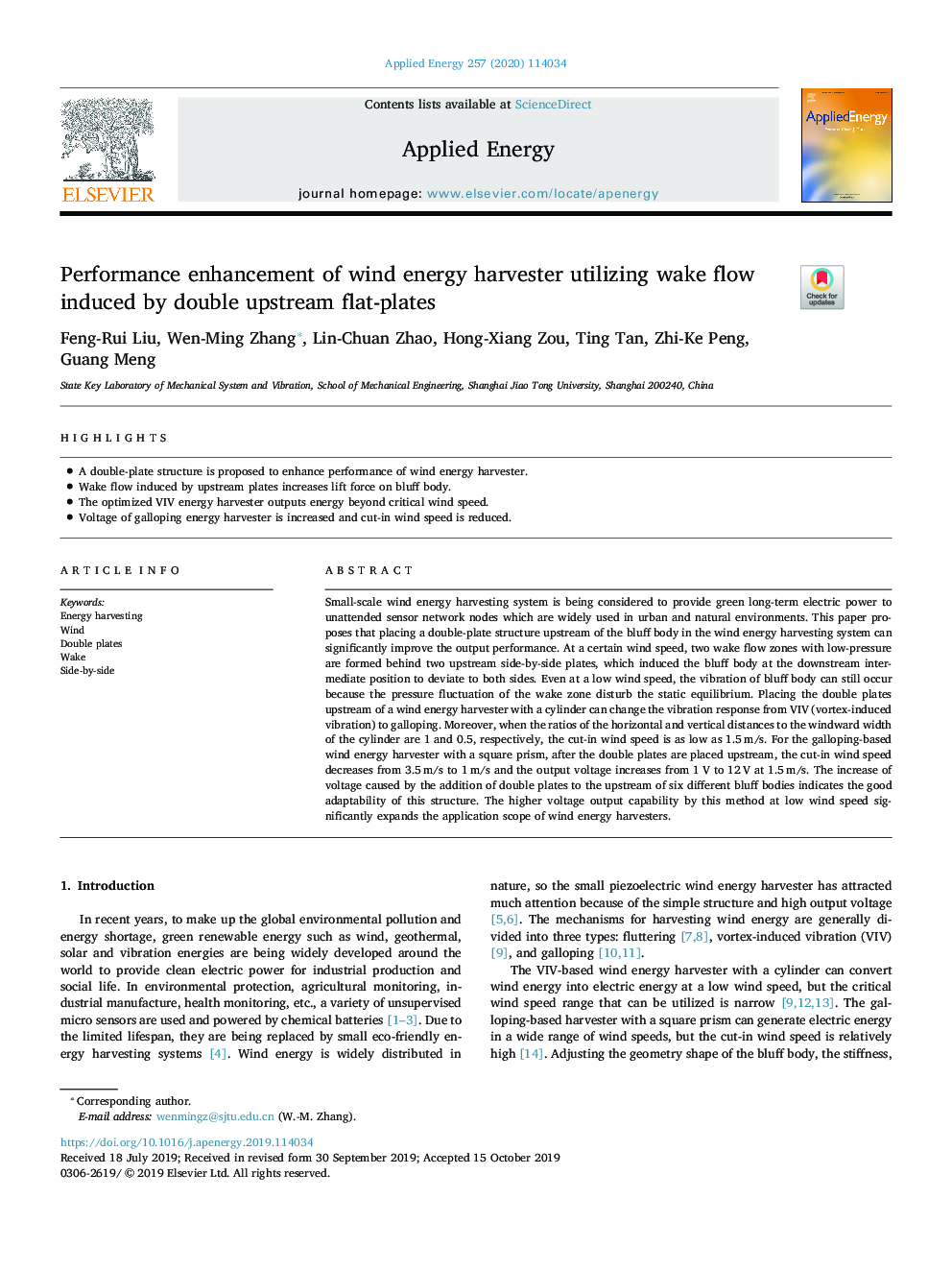 Performance enhancement of wind energy harvester utilizing wake flow induced by double upstream flat-plates