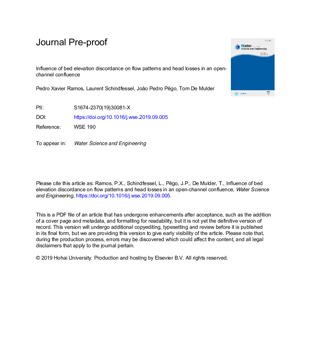 Influence of bed elevation discordance on flow patterns and head losses in an open-channel confluence