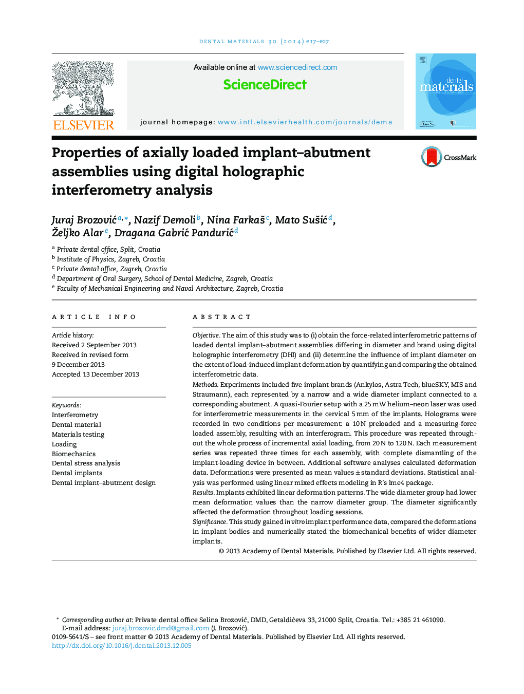 Properties of axially loaded implant–abutment assemblies using digital holographic interferometry analysis